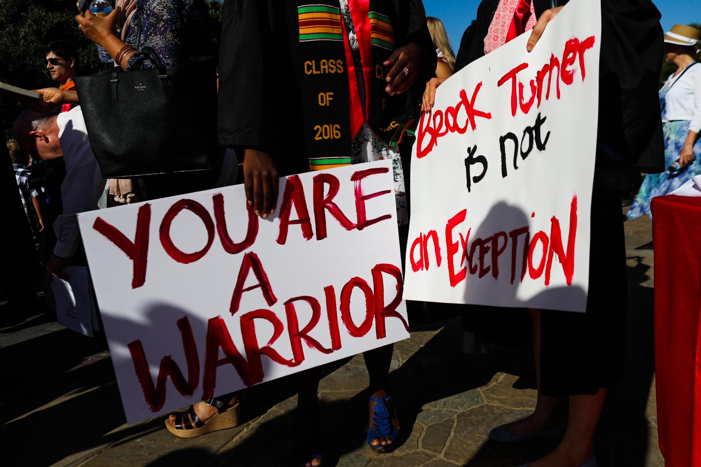 Stanford students carried signs in solidarity with the Stanford sexual assault survivor known as Emily Doe during graduation ceremonies at Stanford University in Palo Alto, California, on 12 June, 2016.