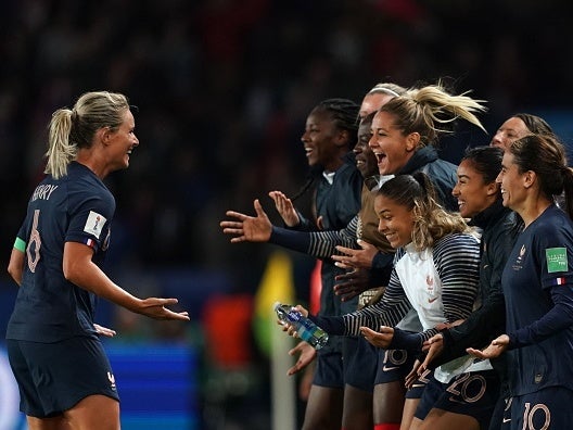 Amandine Henry is congratulated by teammates