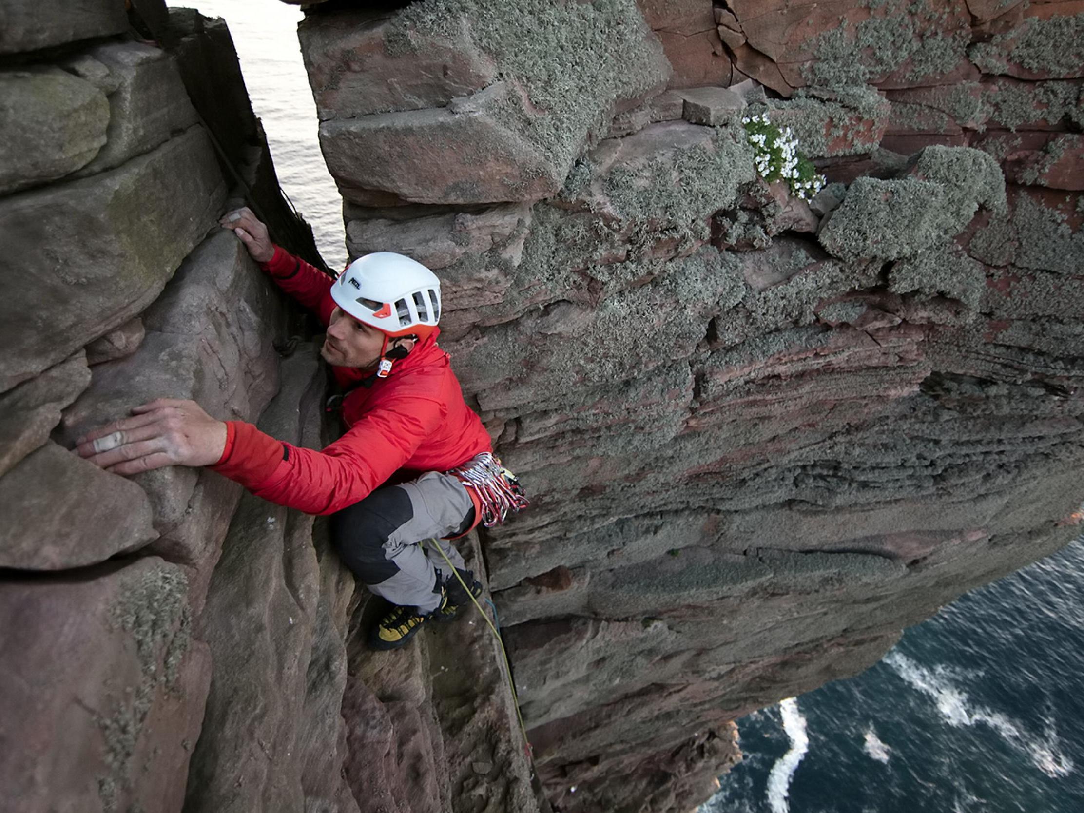 Jesse Dufton had a radio link to his partner but had to use touch to find holds and suitable spots for protective gear