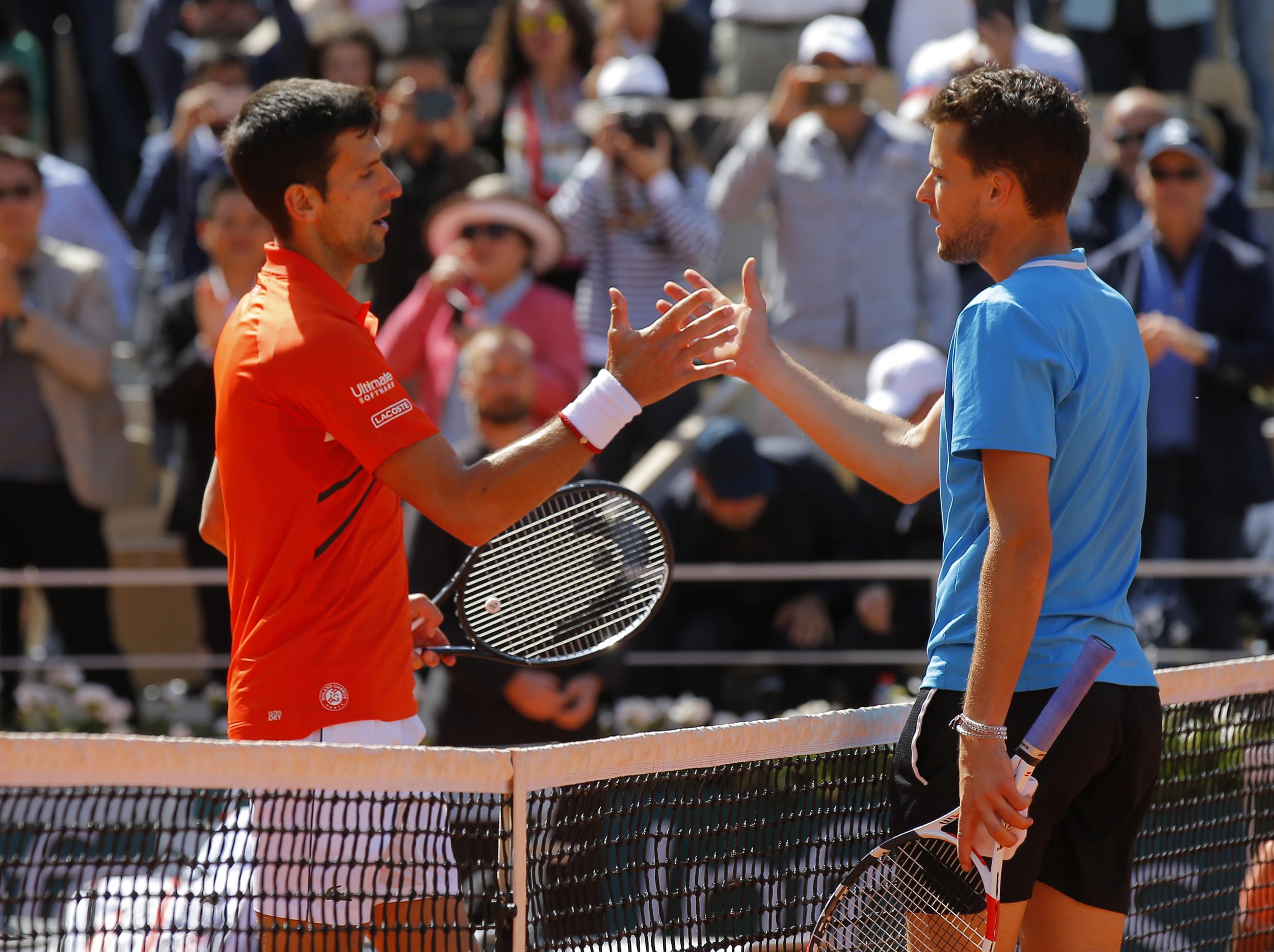 The two men shake hands after their epic