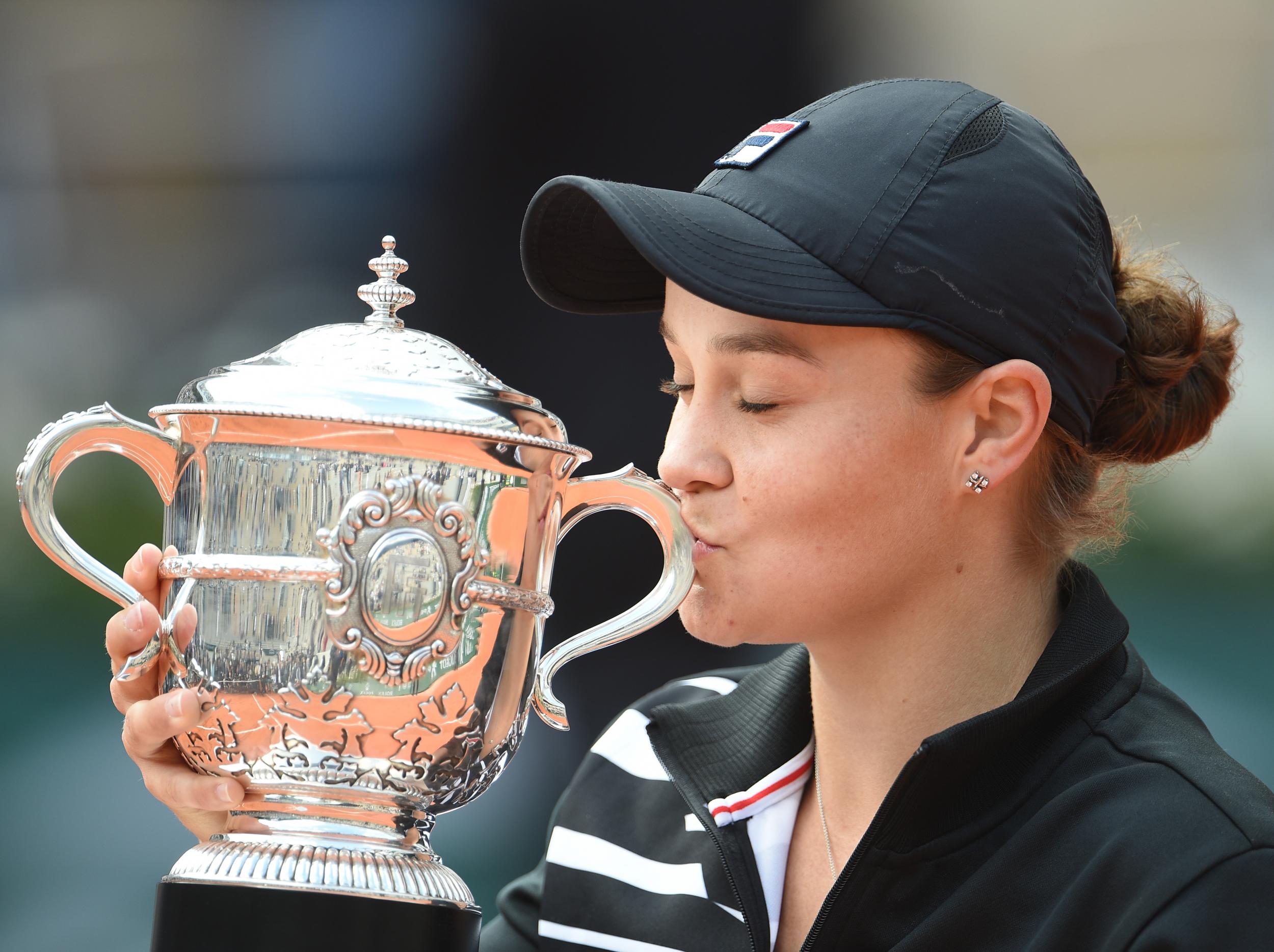 Barty holds her trophy