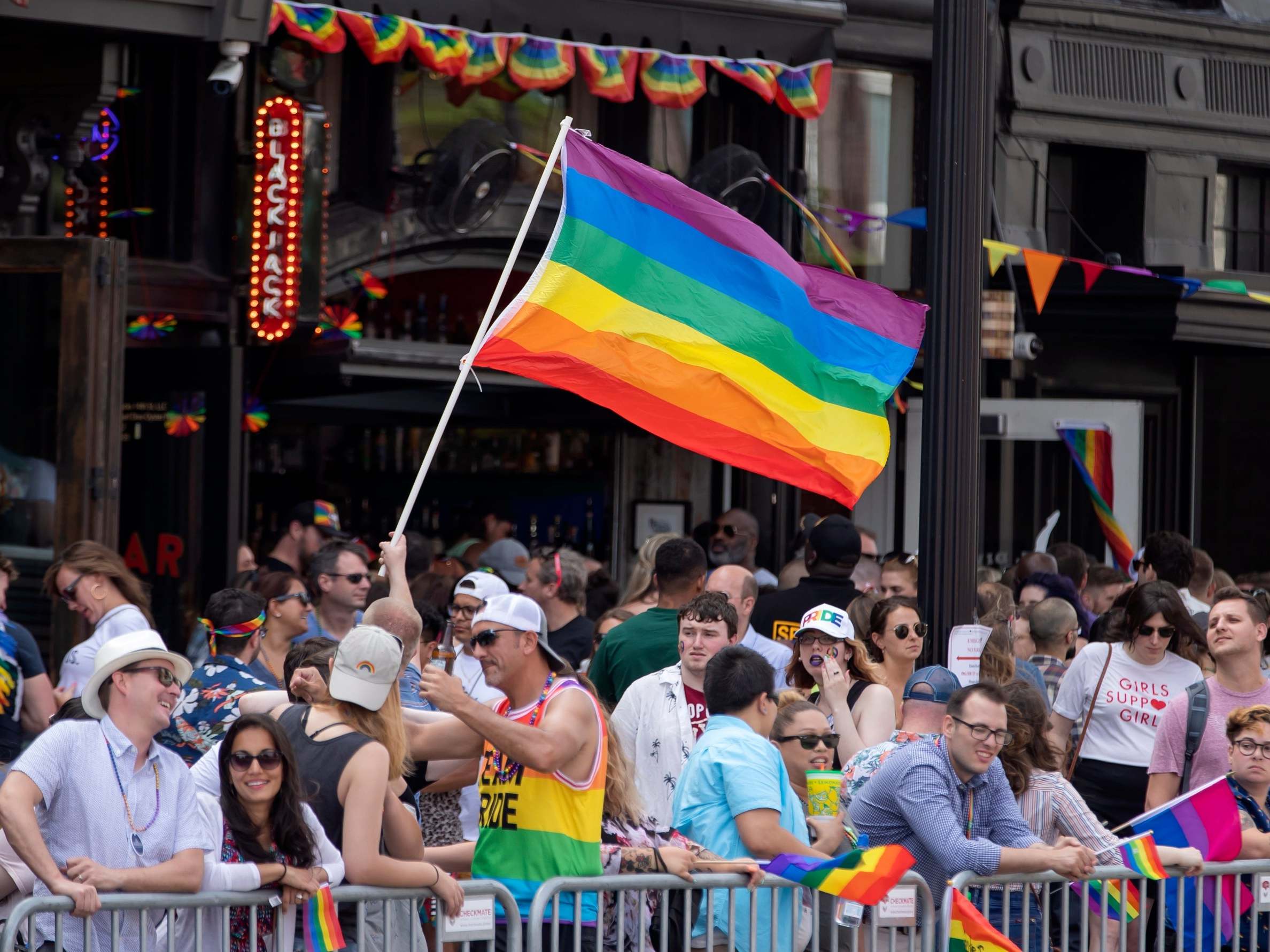 People gather to watch the DC Pride Parade in Washington, DC