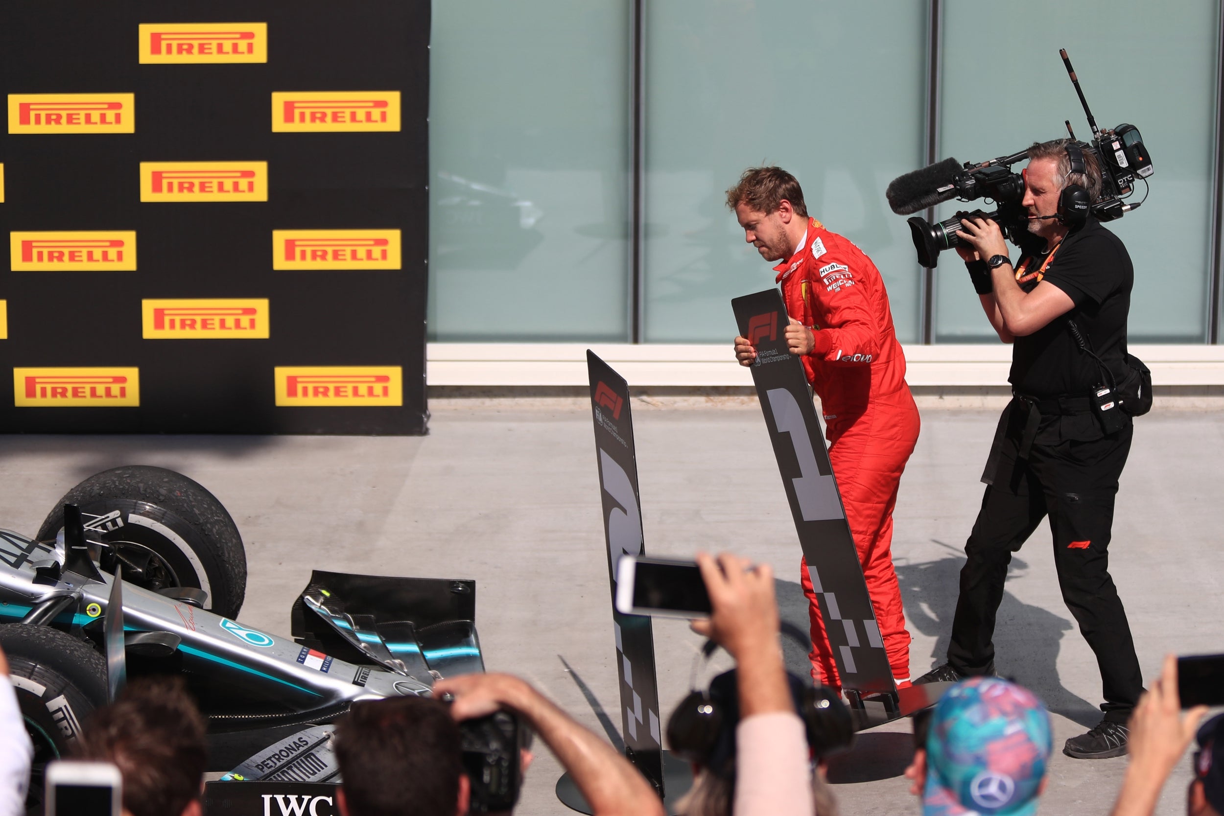 Vettel switches the rostrum position signs around (Getty)