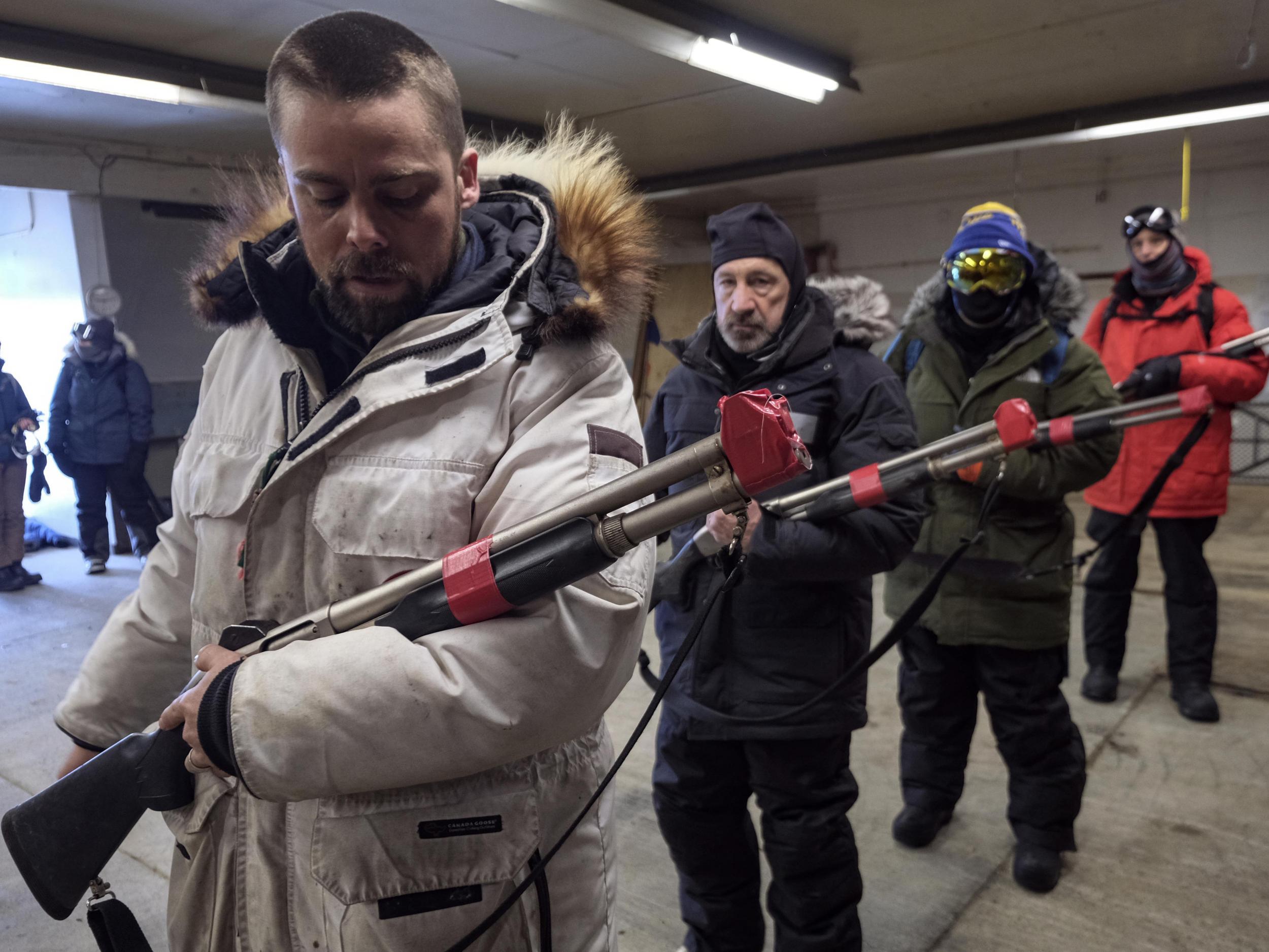 Chris Polashenski leads a gun safety tutorial