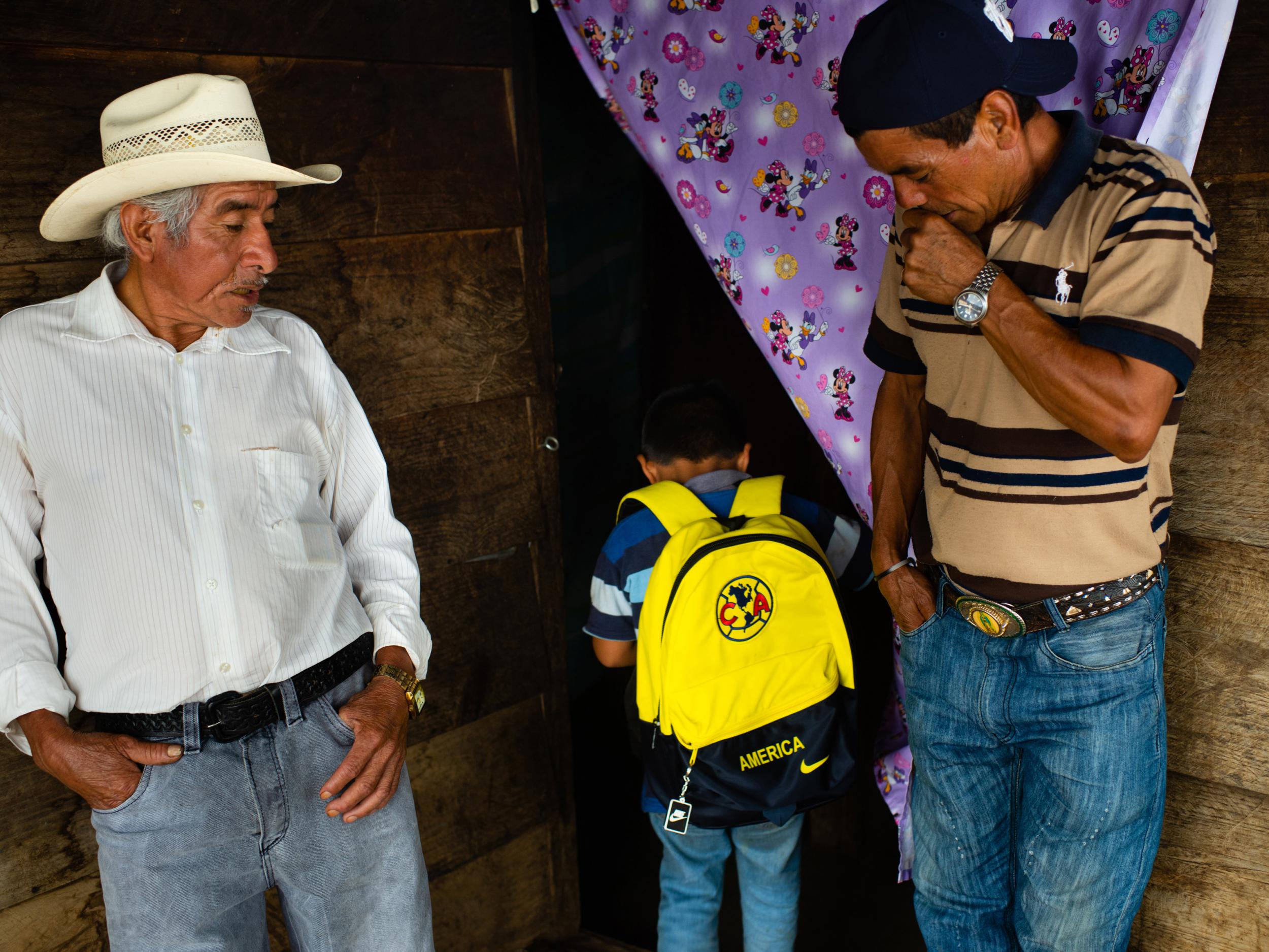 Carrillo’s son shows his father’s friends the Club America backpack he will use when he travels through Mexico towards the US (Sarah L Voisin/Washington Post)