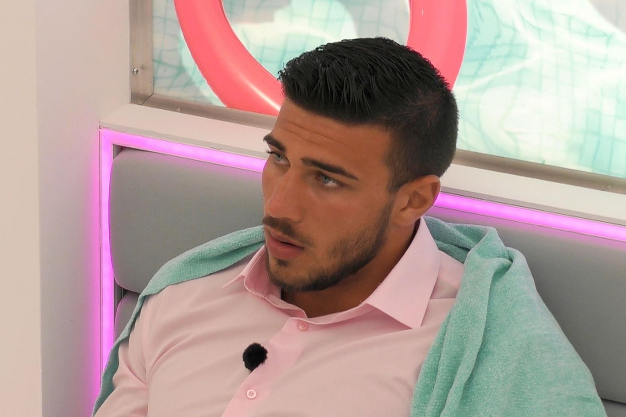 Tommy Fury as Molly-Mae talks to him on 'Love Island'