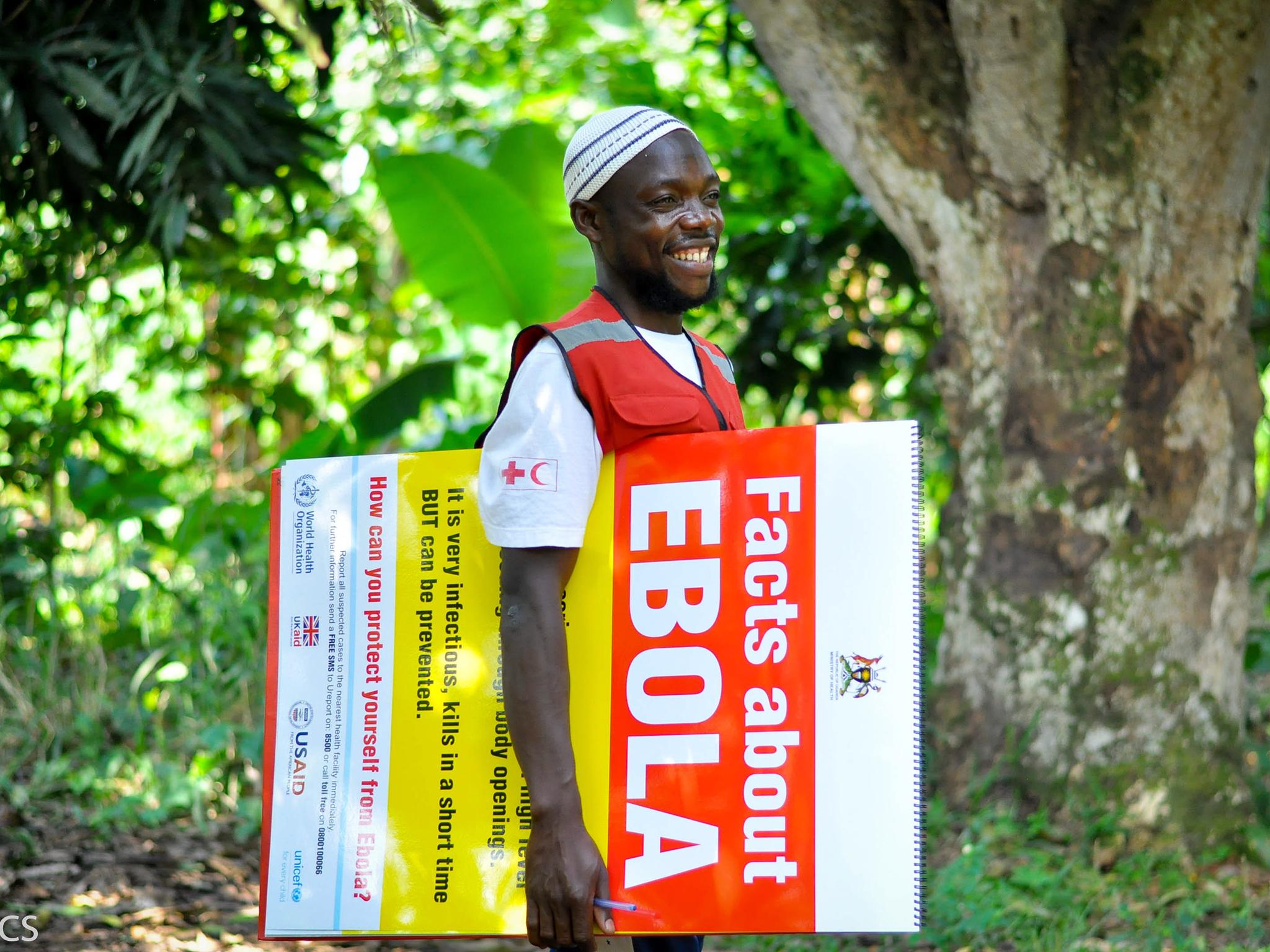 Adam, a volunteer in Bundibugyo, goes door-to-door in hiscommunity