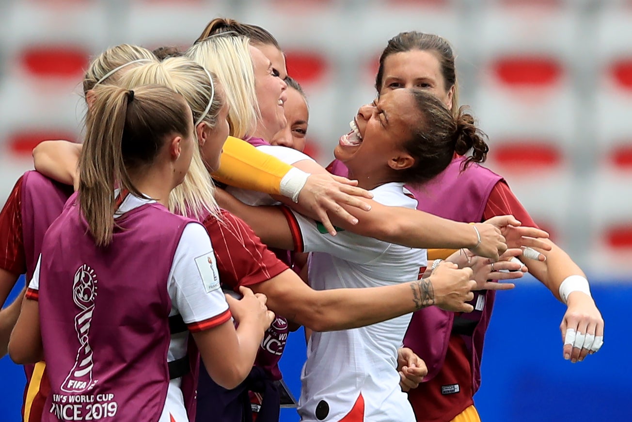 Nikita Parris of England celebrates with team mates