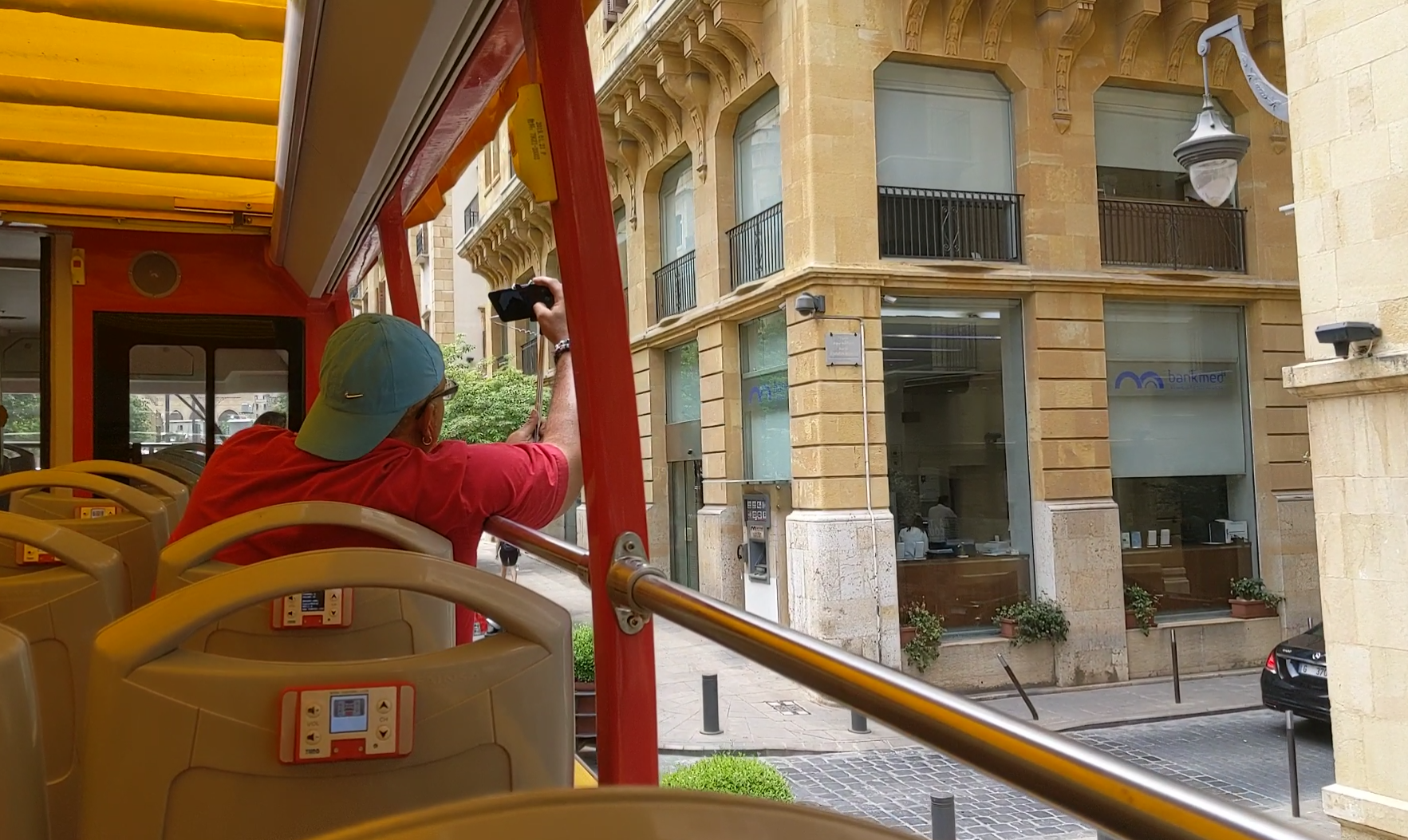 A tourist takes a picture from Beirut’s new City Sightseeing tour