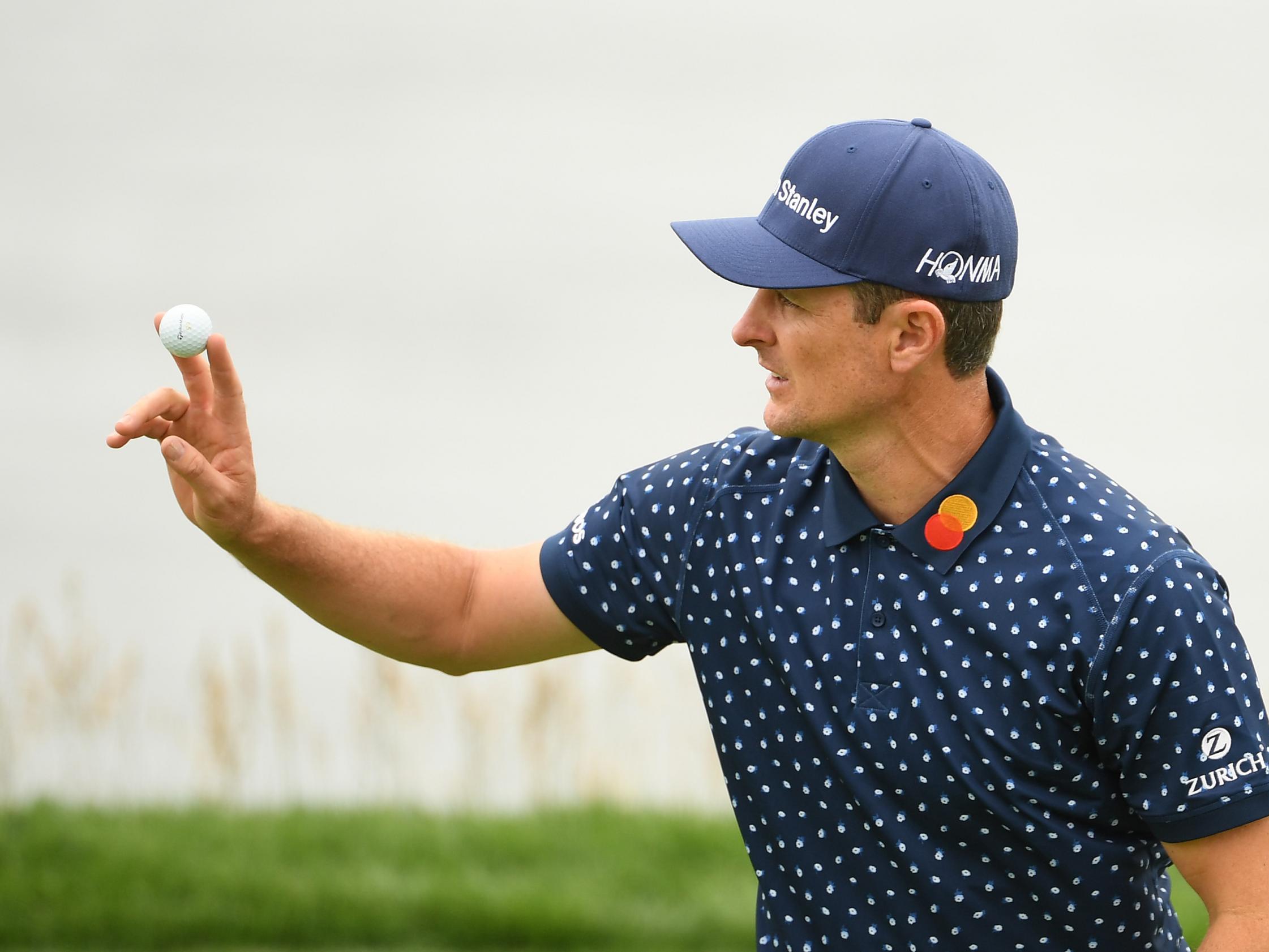 Justin Rose acknowledges the crowds on the eighth green