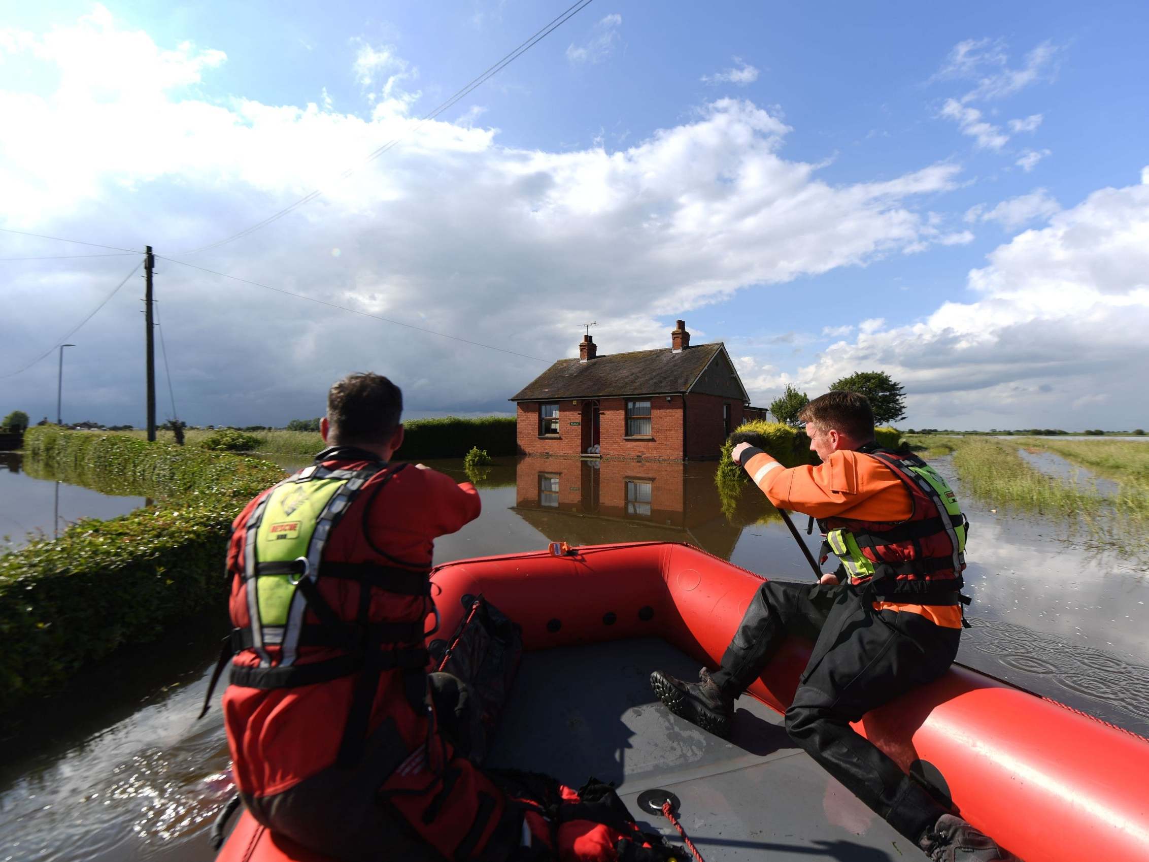 Rescue workers in Wainfleet after the River Steeping breached its banks