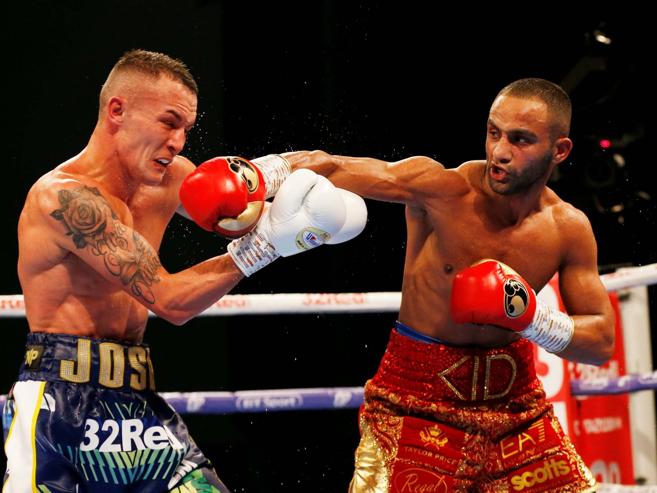 Josh Warrington absorbs a shot from Kid Galahad