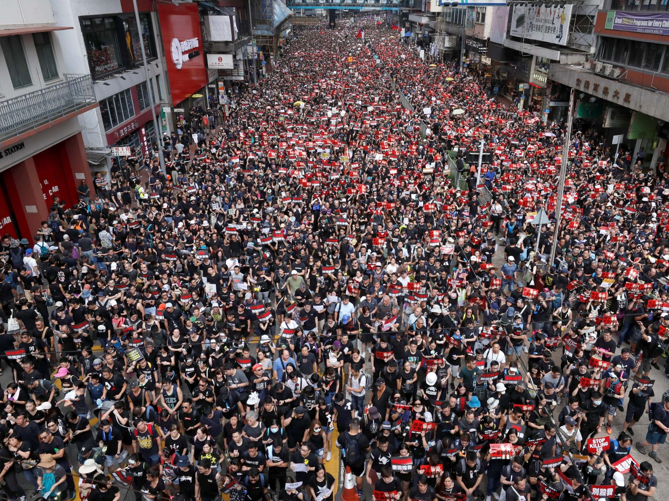 Protesters line the streets demanding Hong Kong's leaders withdraw the extradition bill (Reuters)