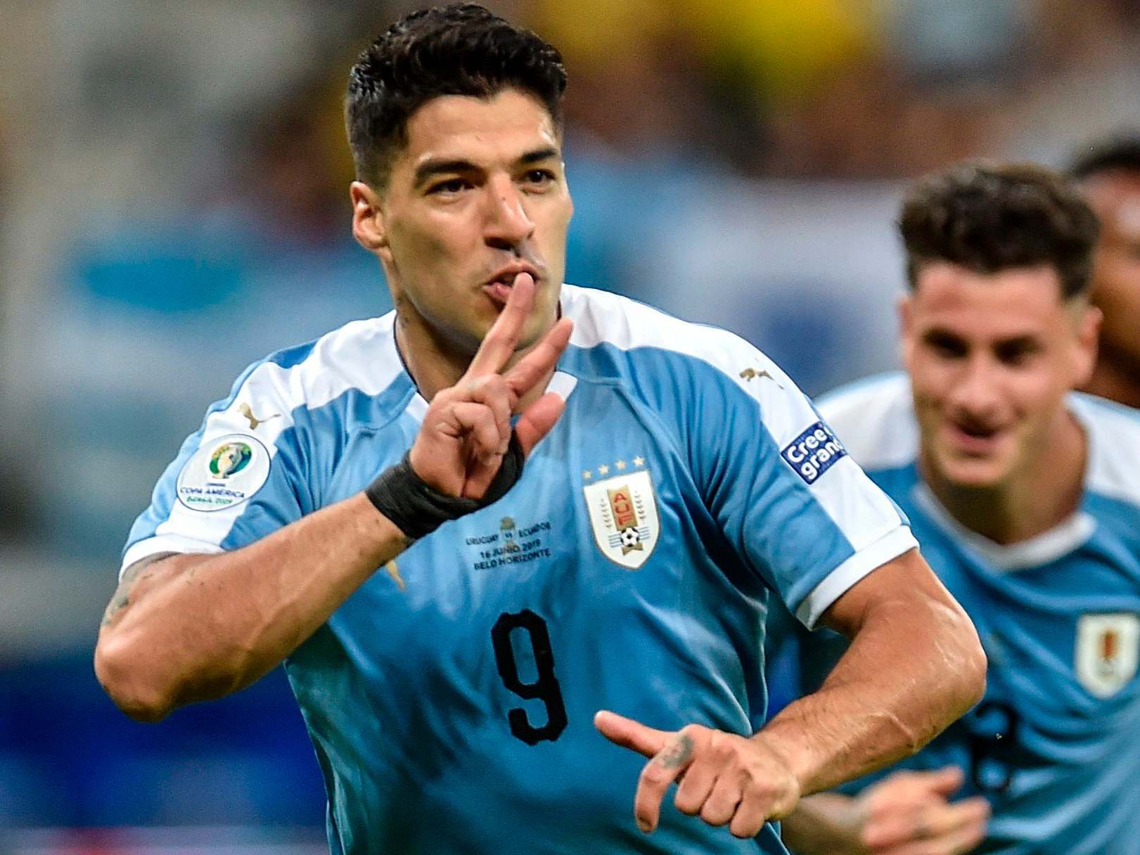 Luis Suarez celebrates scoring vs Ecuador