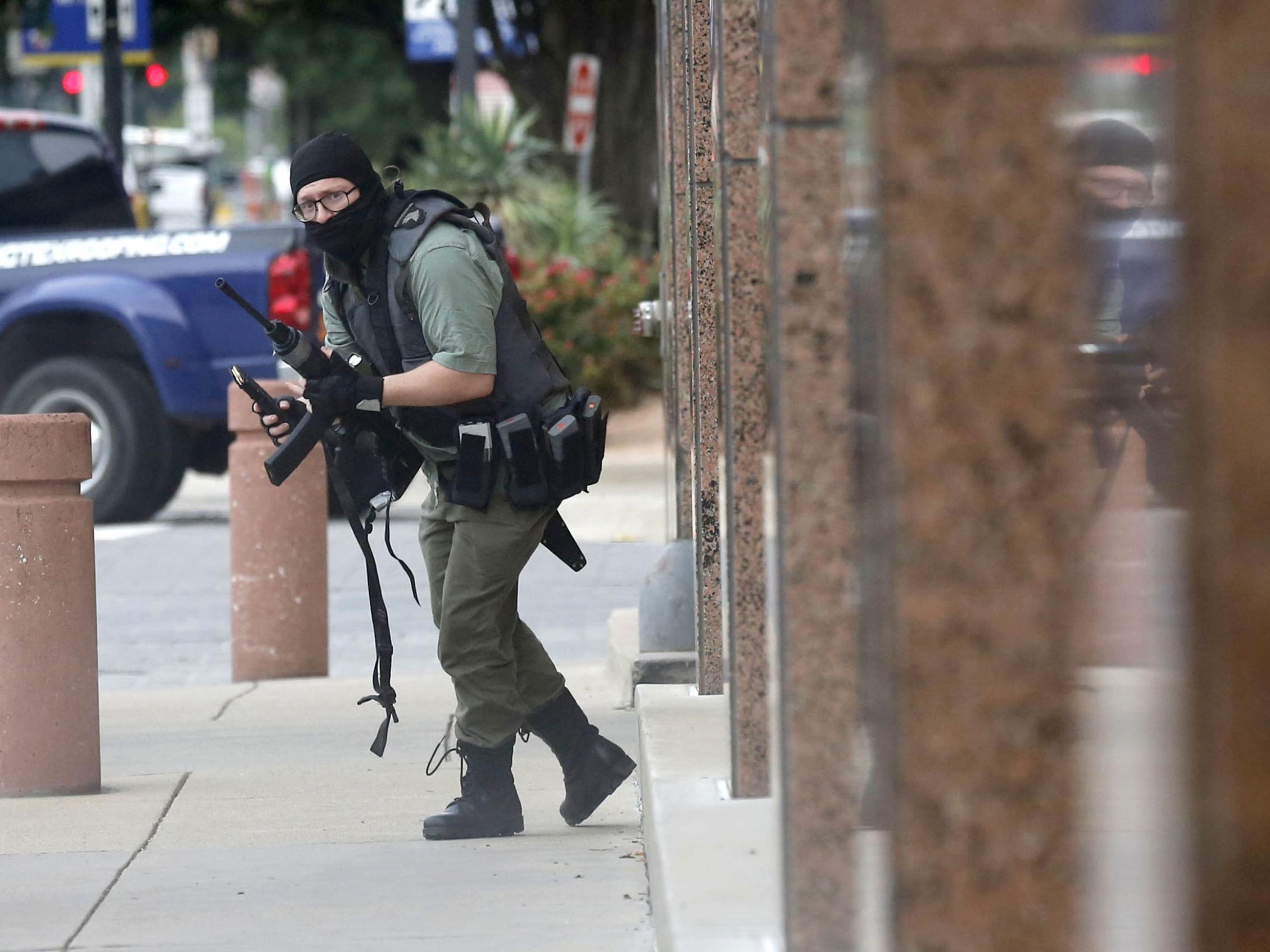 Journalist Tom Fox faces extreme danger to capture images of a gun attack outside Dallas courthouse