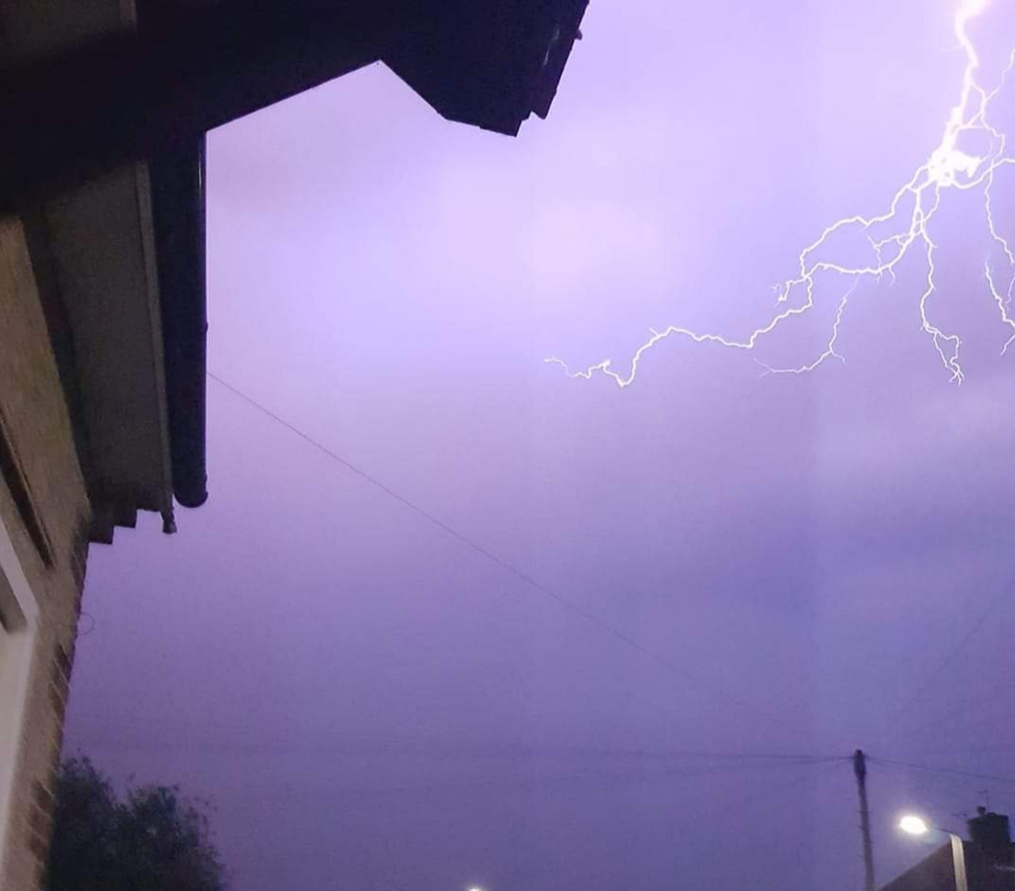 Lightning seen from a house in Canterbury as torrential rain and a spectacular electrical storm lashed parts of the UK on Tuesday night