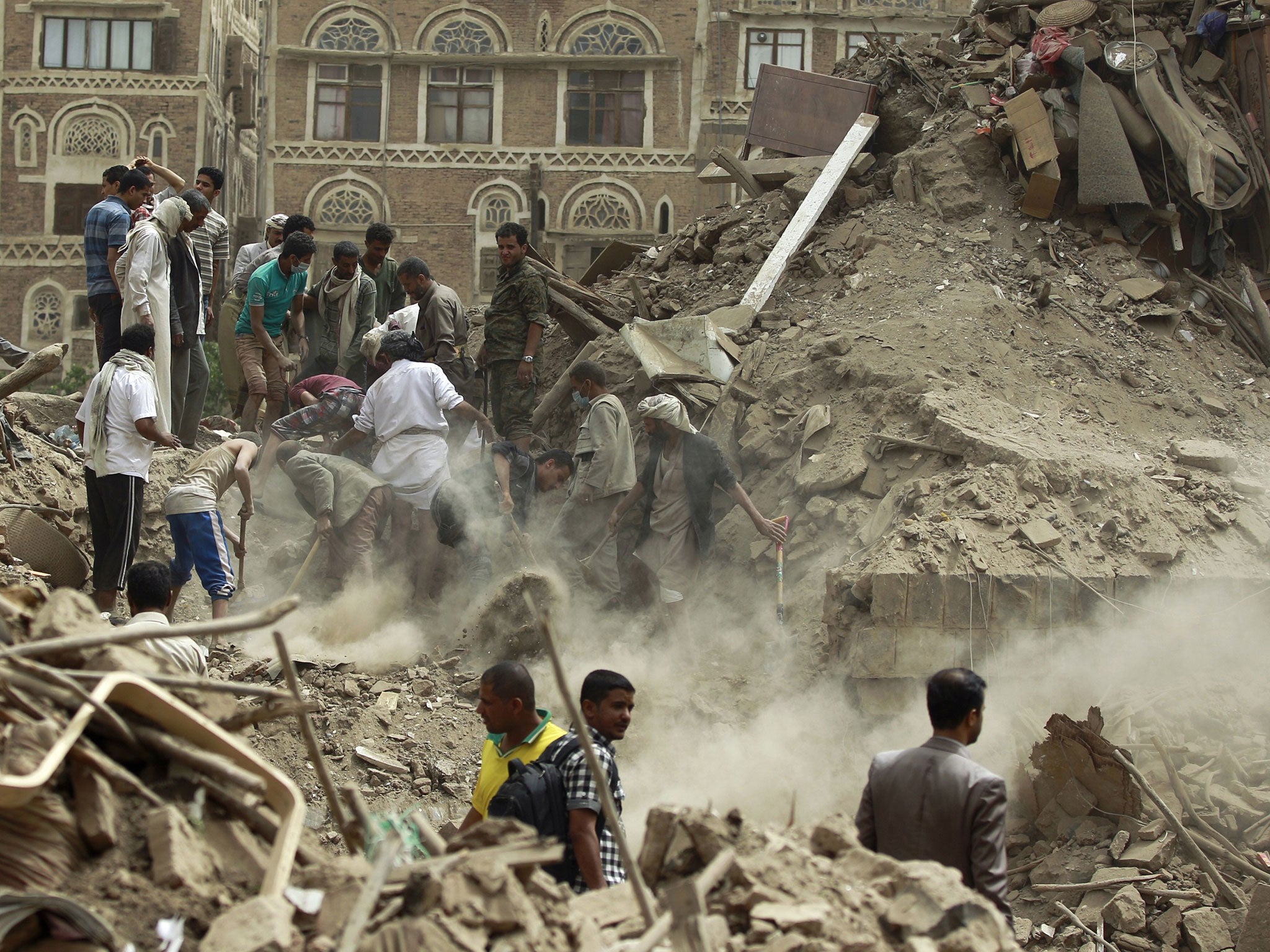 Yemenis search for survivors under the rubble of houses in the Unesco-listed heritage site in the old city of Yemeni capital Sana’a, in June 2015 following an overnight Saudi-led airstrike