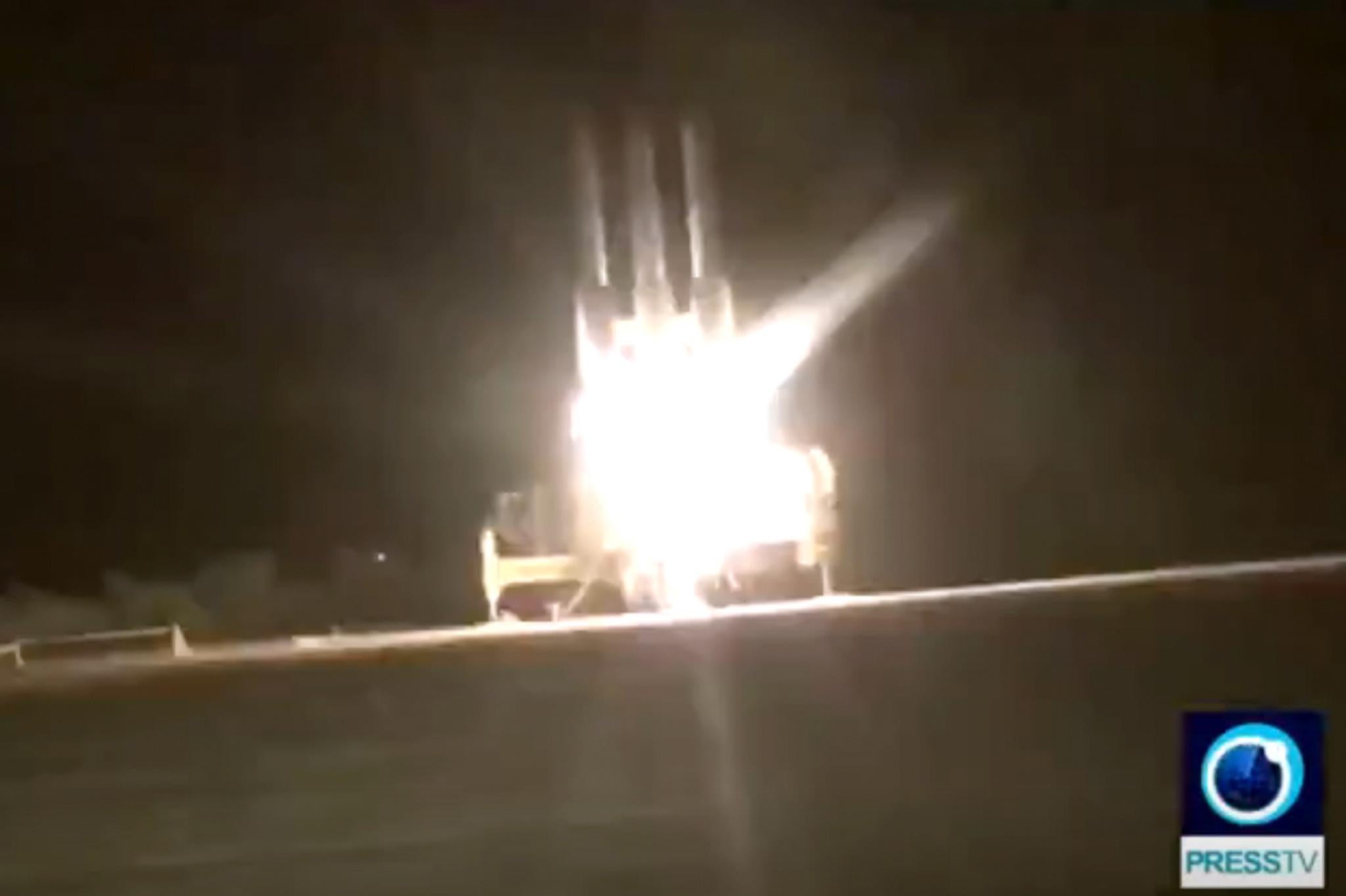 Iran claims that in this picture released by Iran state TV, their surface-to-air missile is seen as it shoots down a US surveillance drone