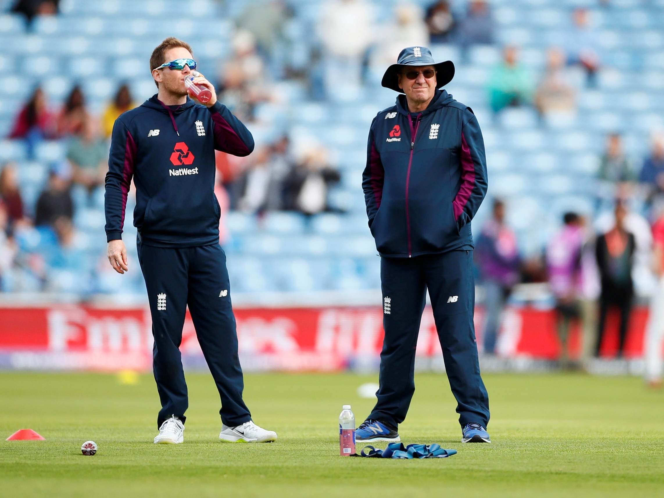 Trevor Bayliss and Eoin Morgan converse on the pitch (Reuters)