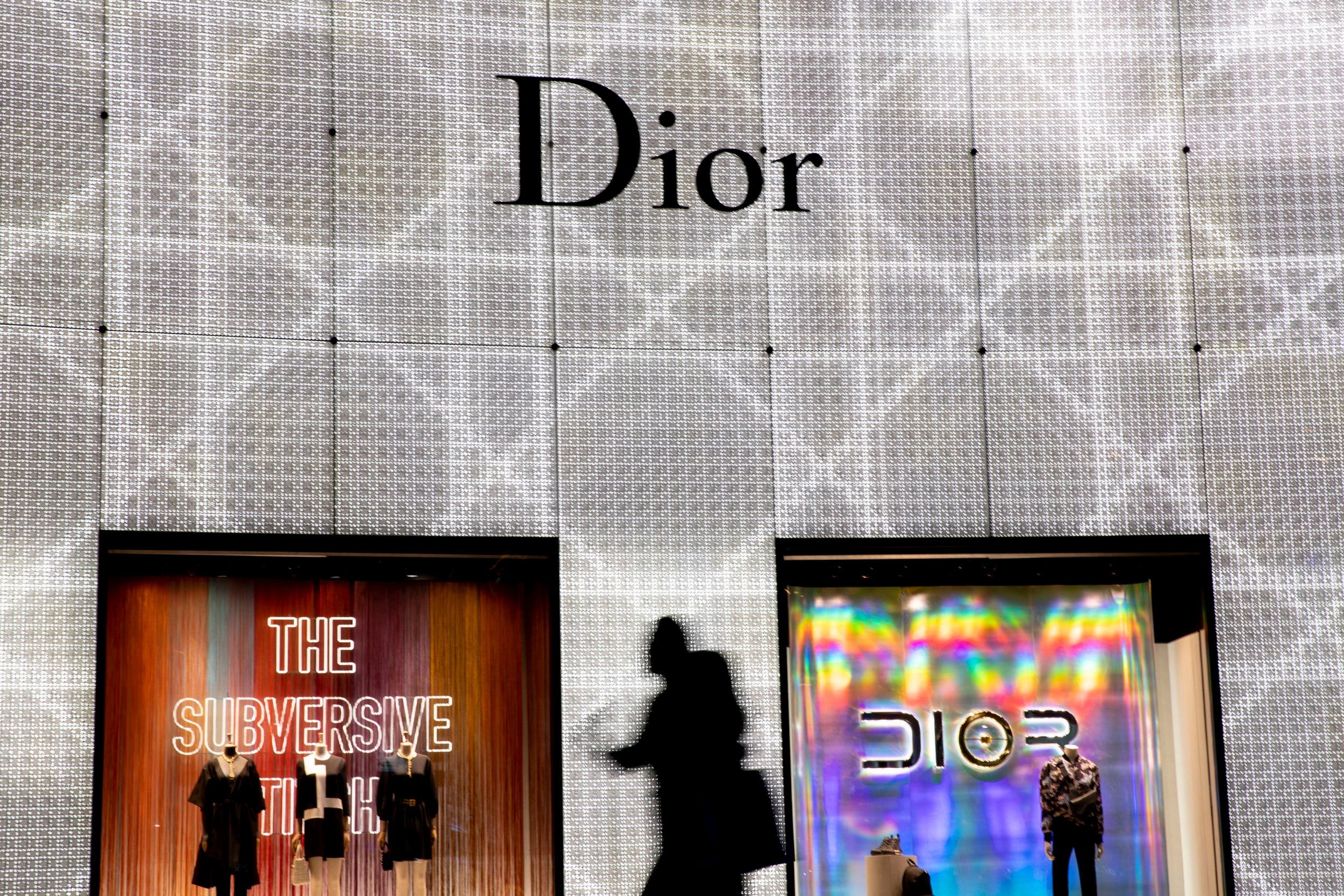 A woman walks past the brightly lit storefront display of the Dior outlet at the ION Orchard shopping mall. Ongoing studies and modeling on the broader impact are looking at links to hormone imbalance and diseases, including the occurrence of eye diseases that may be attributed to the mixed sources of lighting used often in street lighting and advertising
