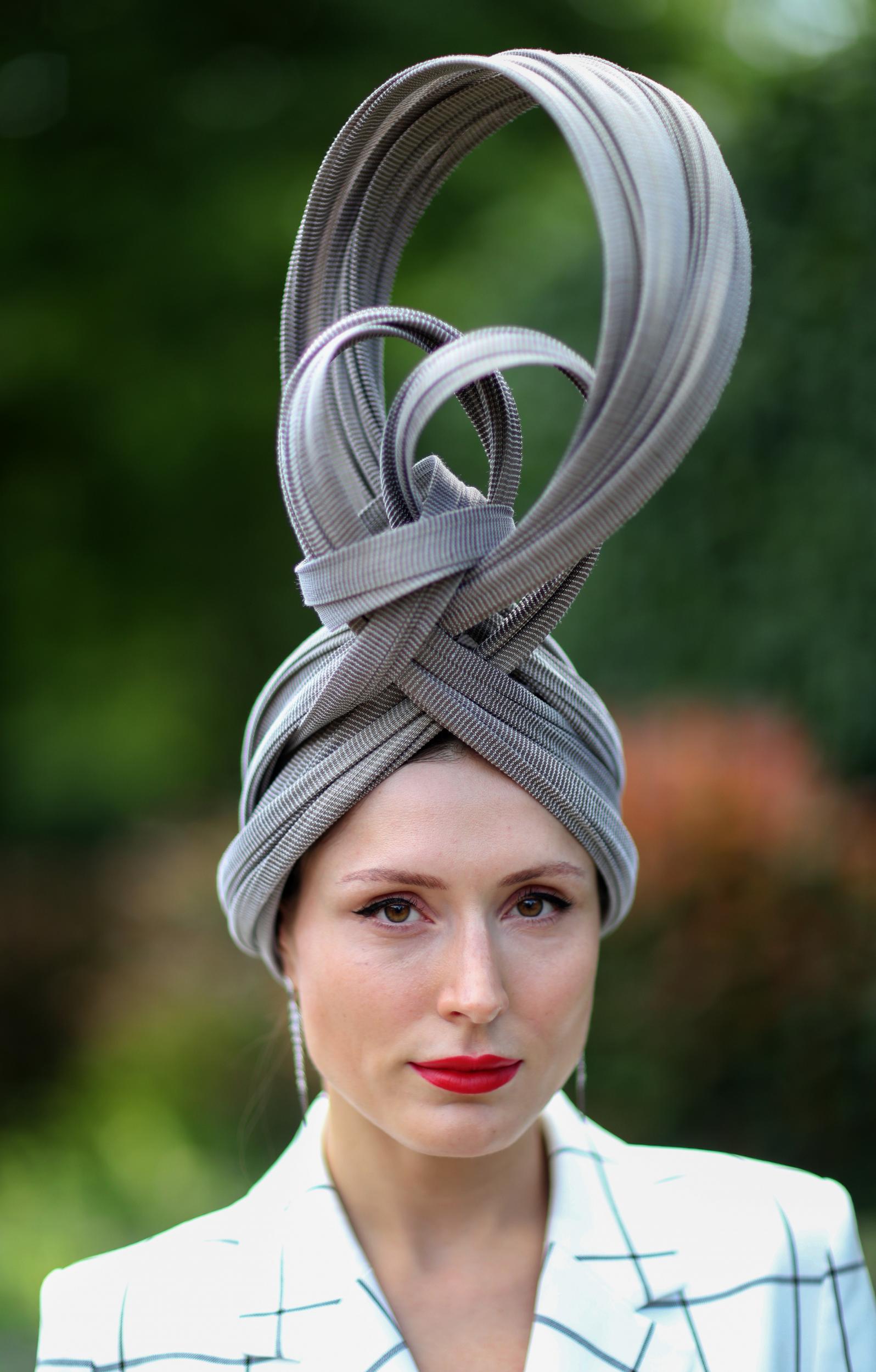 Entrepreneur and businesswoman Valerie Stark stuns at the races wearing a sculptural headpiece by boutique milliner Jane Taylor London.