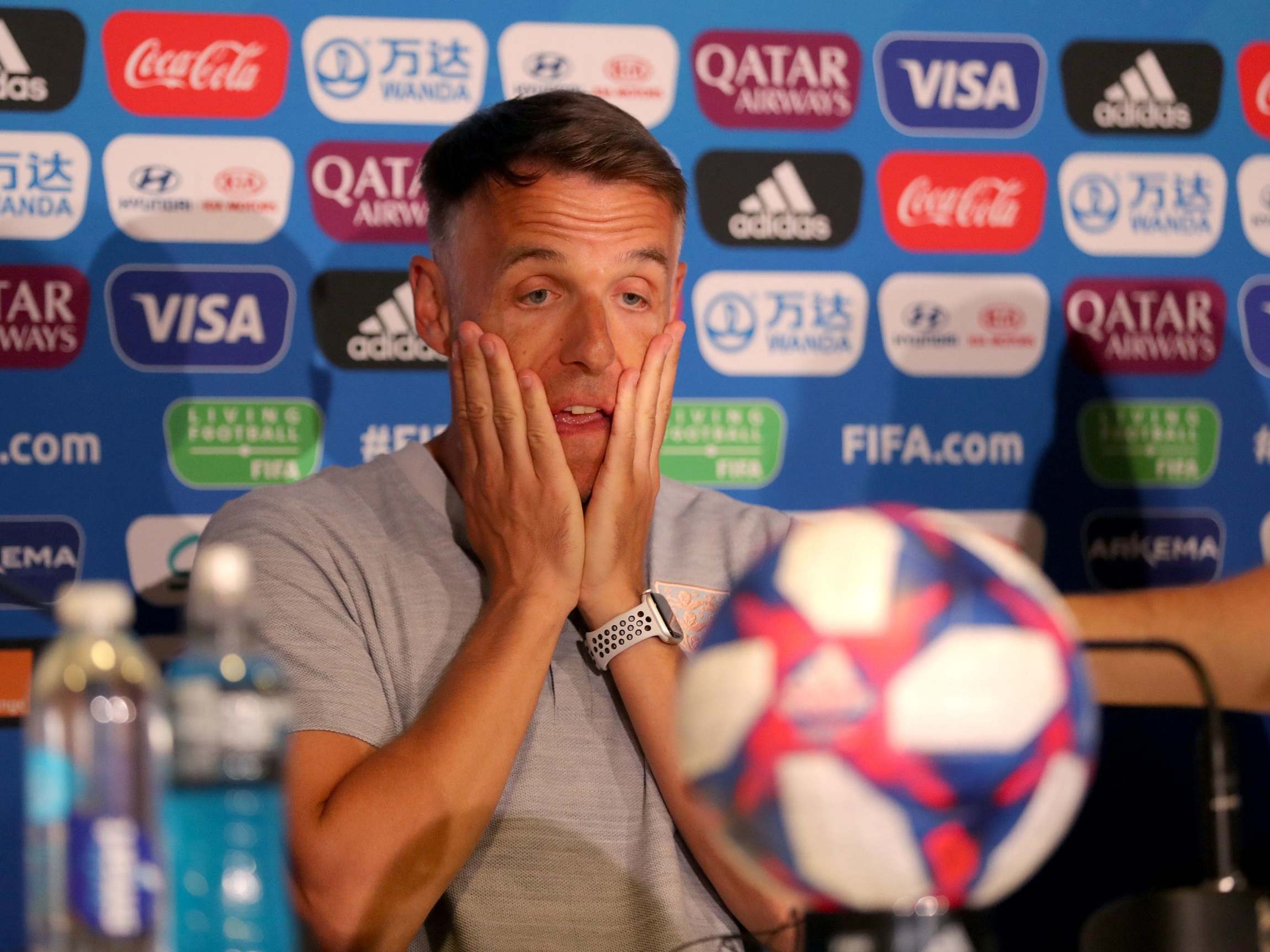 The England manager Phil Neville speaks to the media