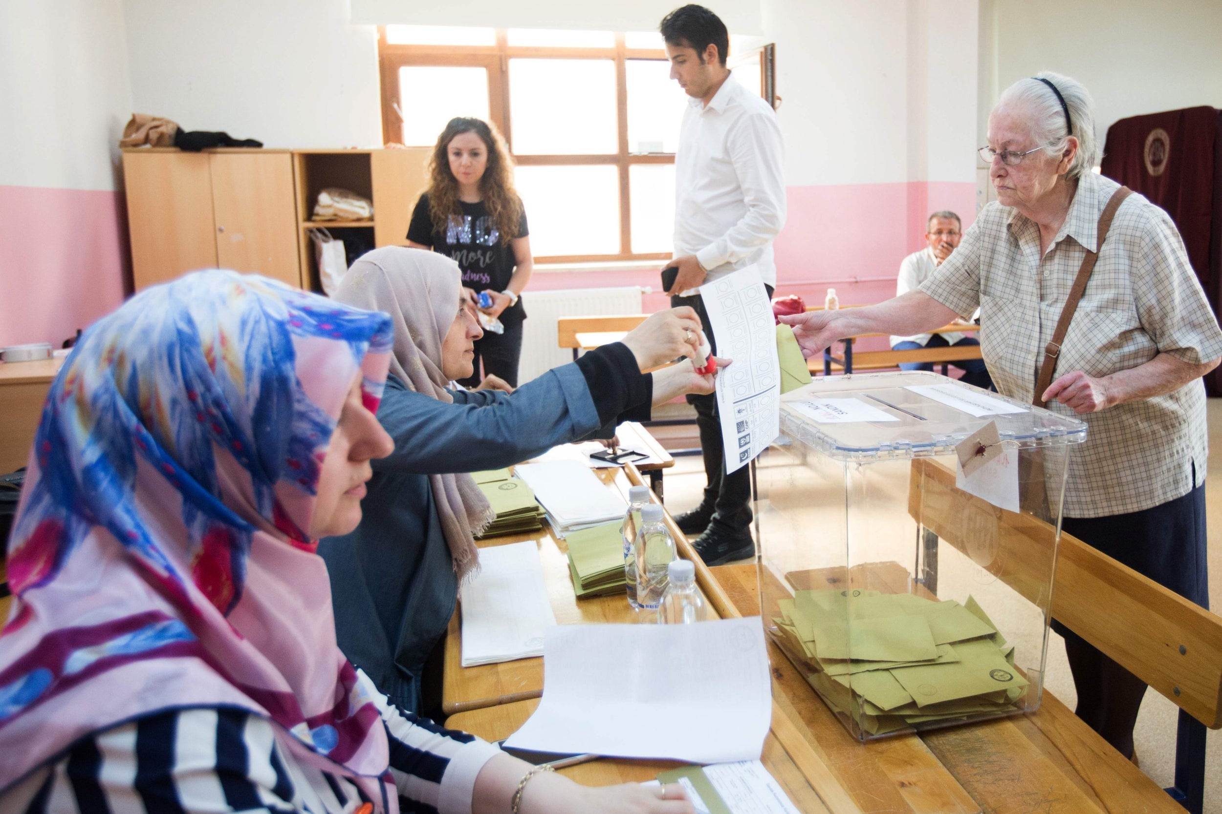 A woman votes at a polling station in Istanbul during the mayoral election which is viewed as a test of Turkish democracy and President Recep Tayyip Erdogan's popularity