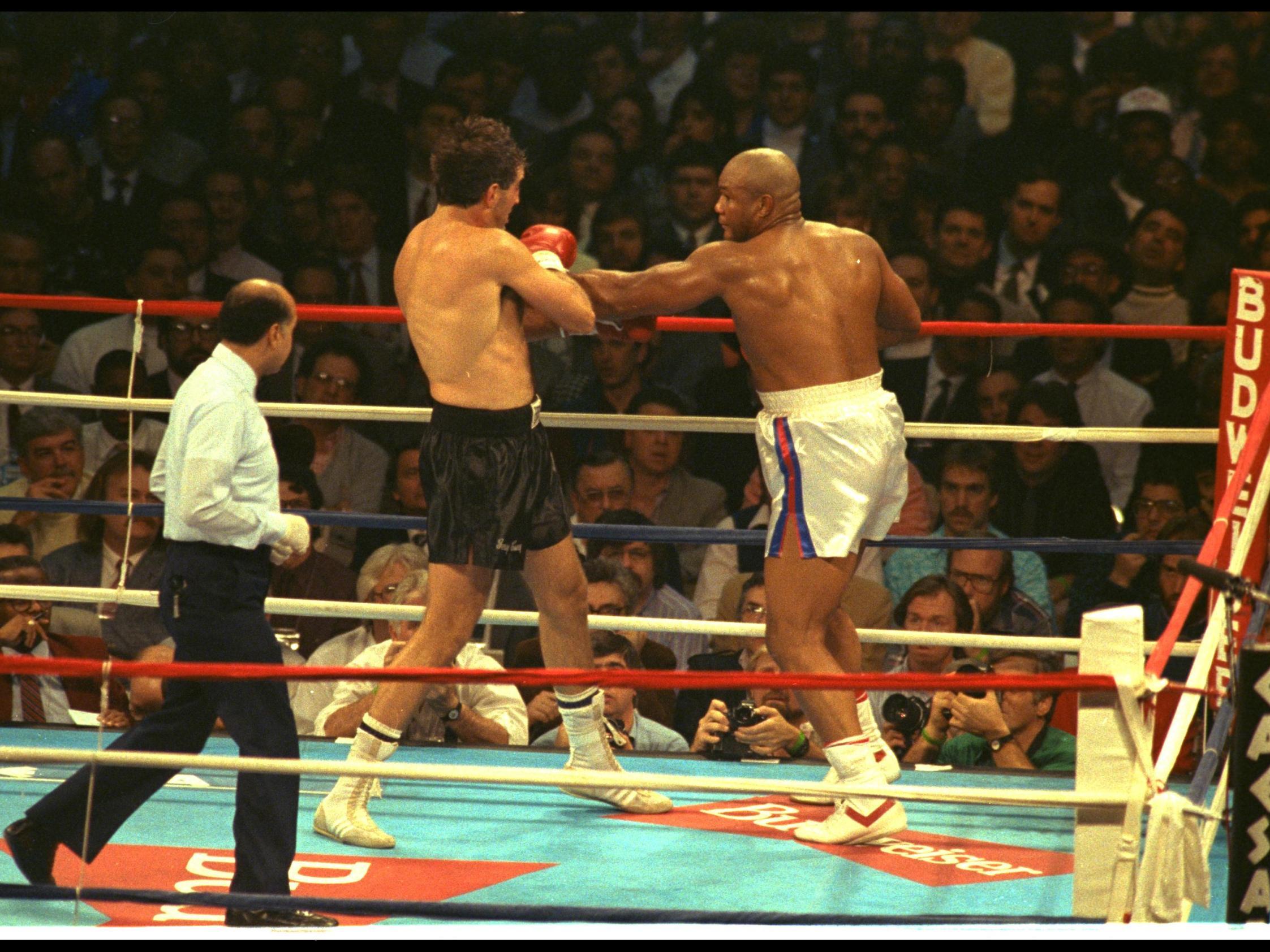 Gerry Cooney in action against George Foreman during their 1990