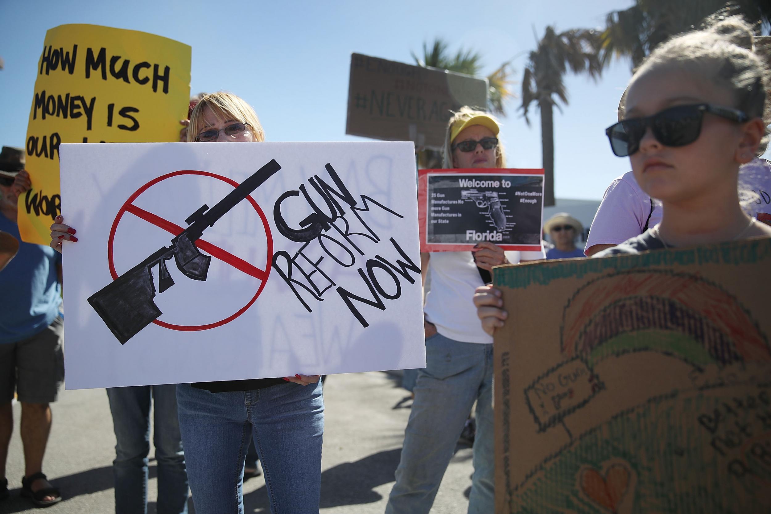 Activists protest in front of Kalashnikov USA, a gun manufacturer that makes an AK-47 rifle