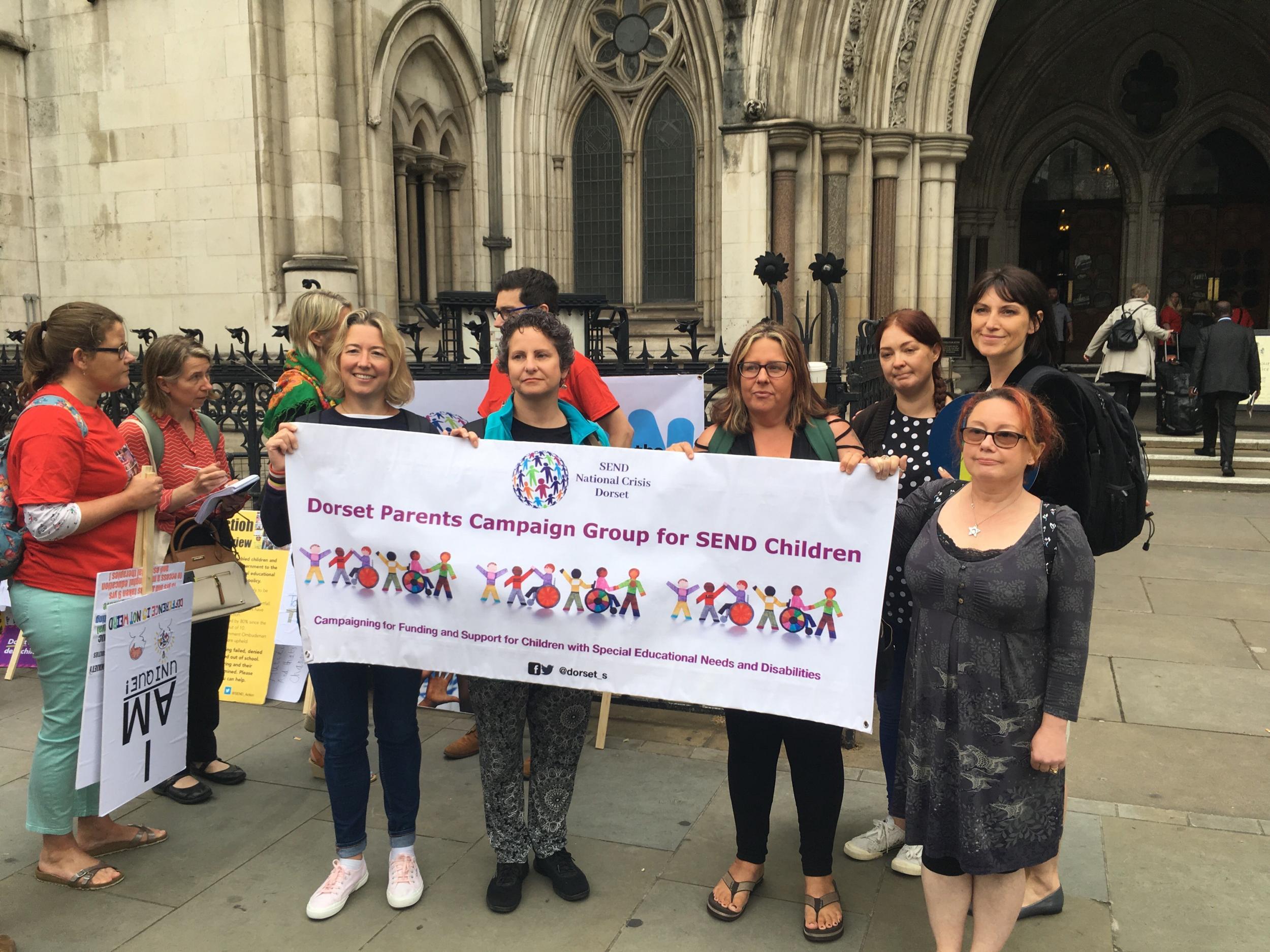 Supporters of three families taking the government to court over special educational needs funding cuts came together