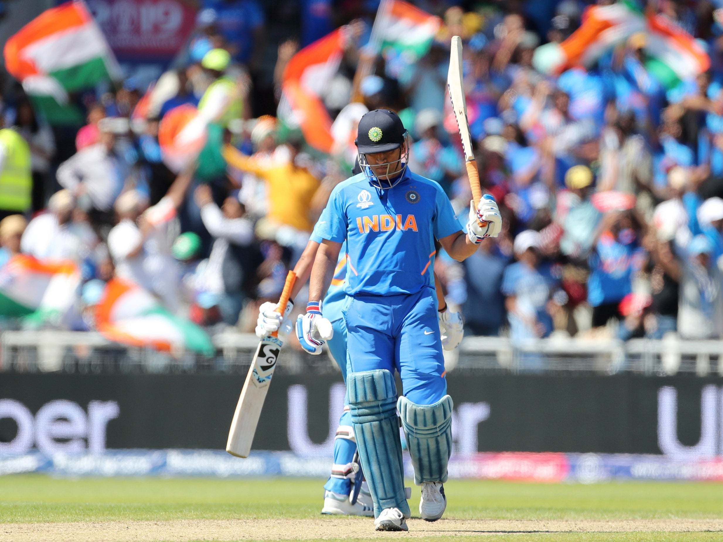 MS Dhoni celebrates scoring a half-century