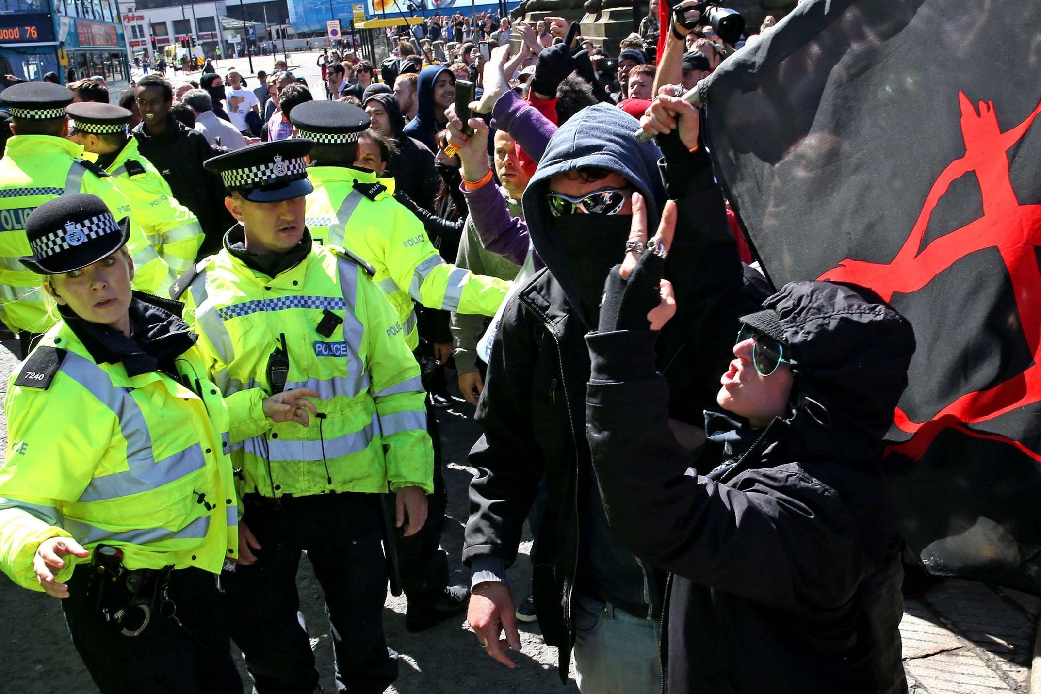 Anti-fascists clash with police during a counter-protest against NA