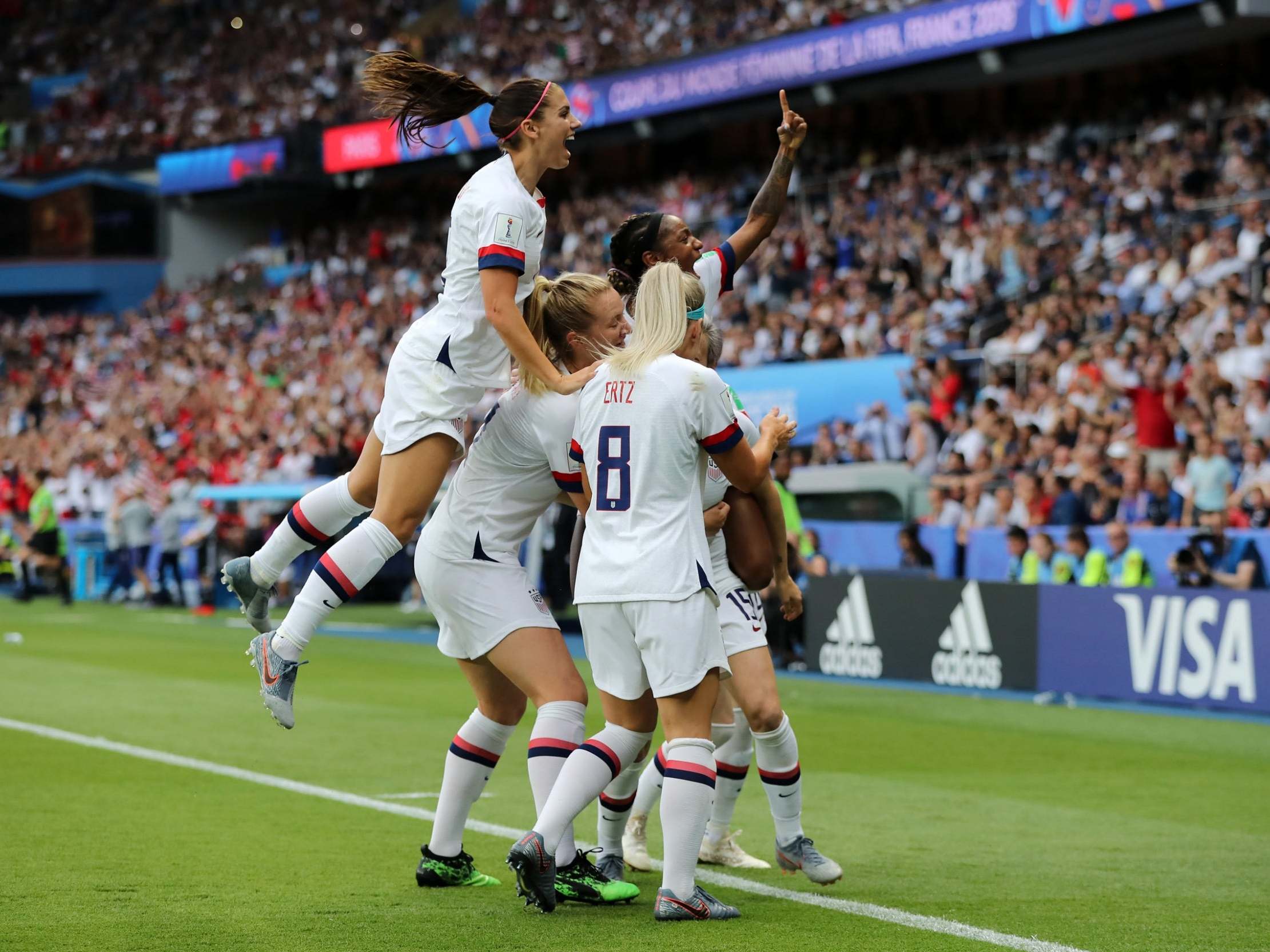 USA celebrate as Megan Rapinoe scores the opener