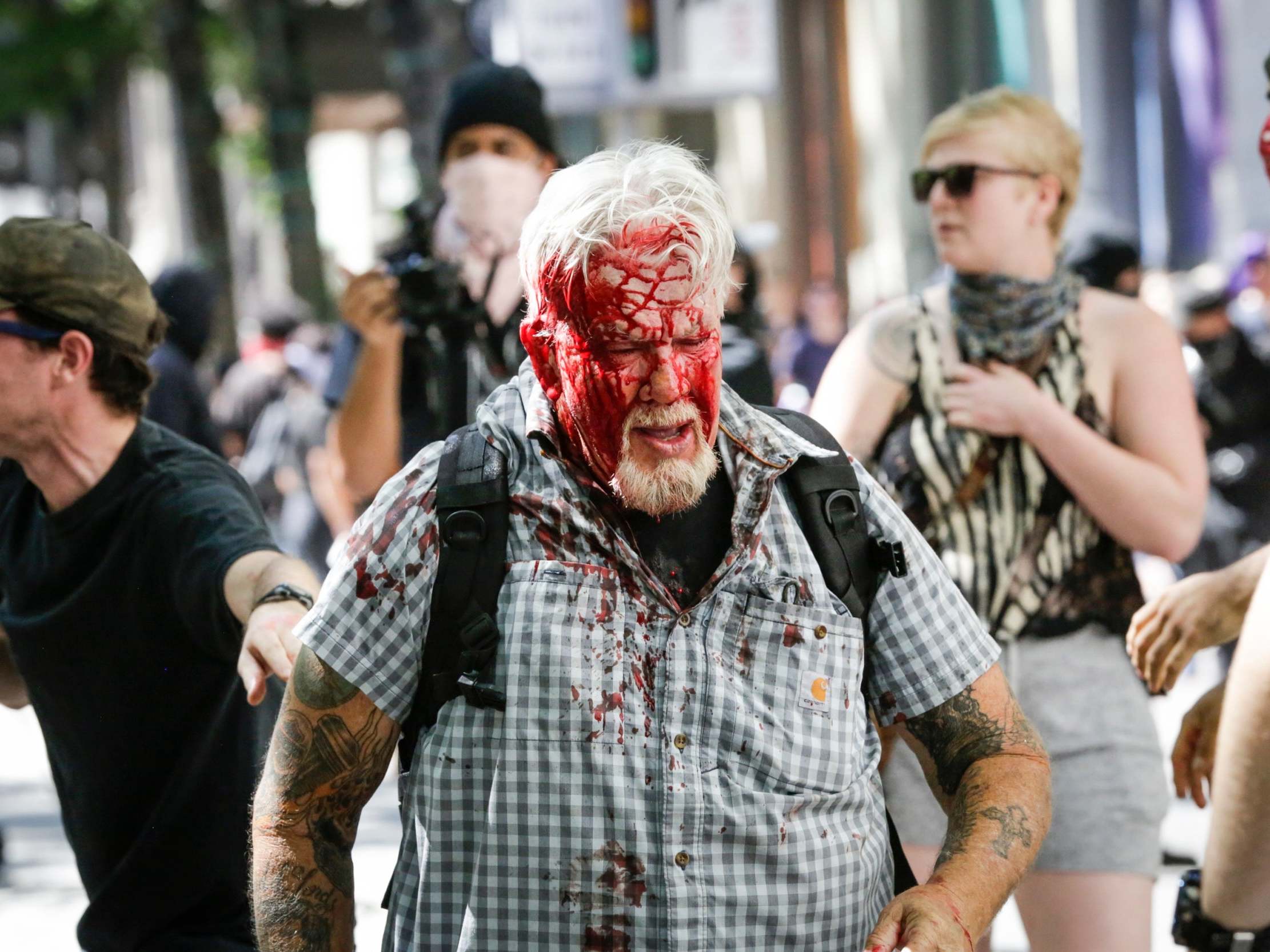 A right-wing protester after being attacked in Portland's Pioneer Courthouse Square on 29 June