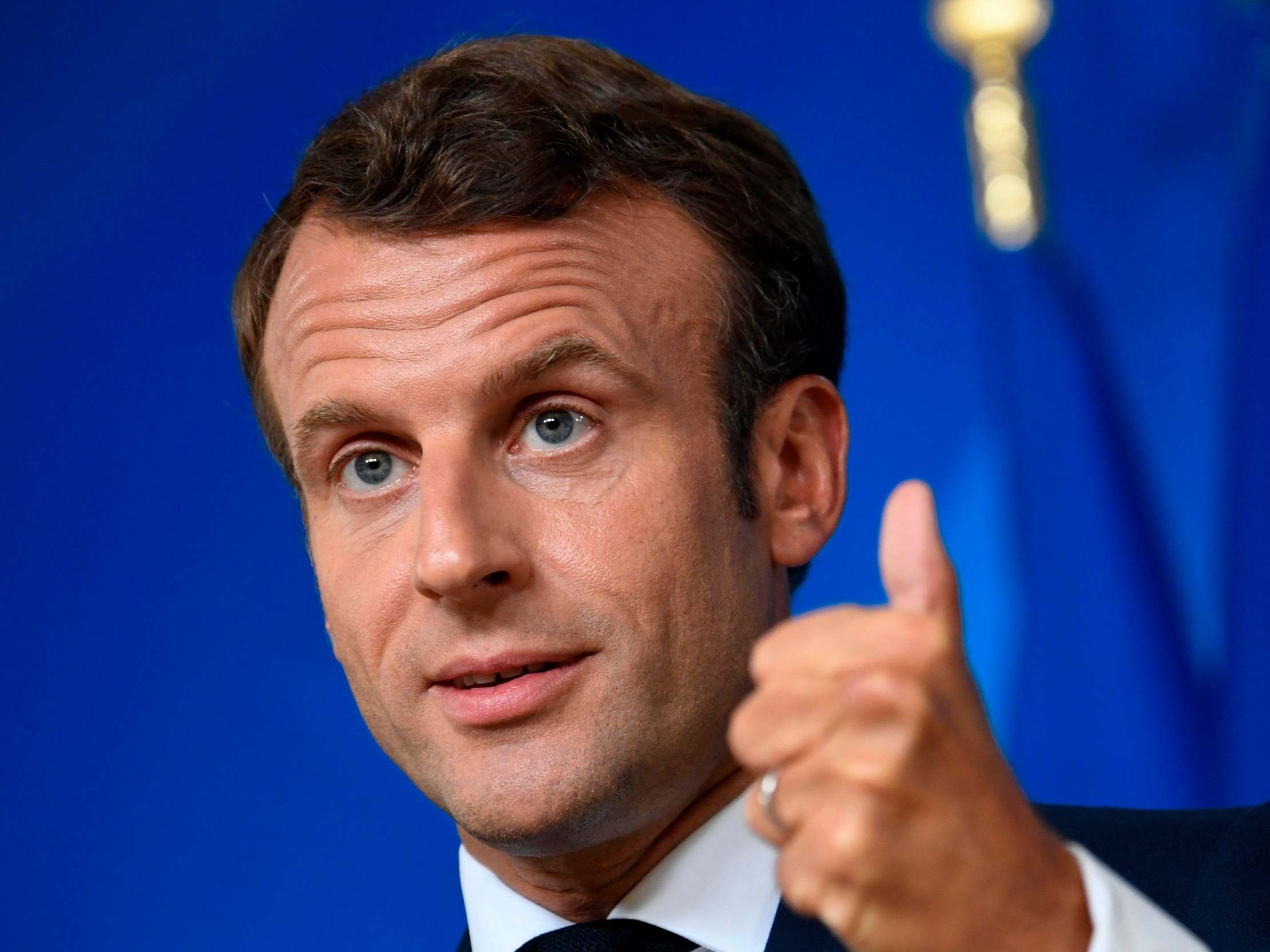 Emmanuel Macron speaks at a press conference at the end of an EU summit