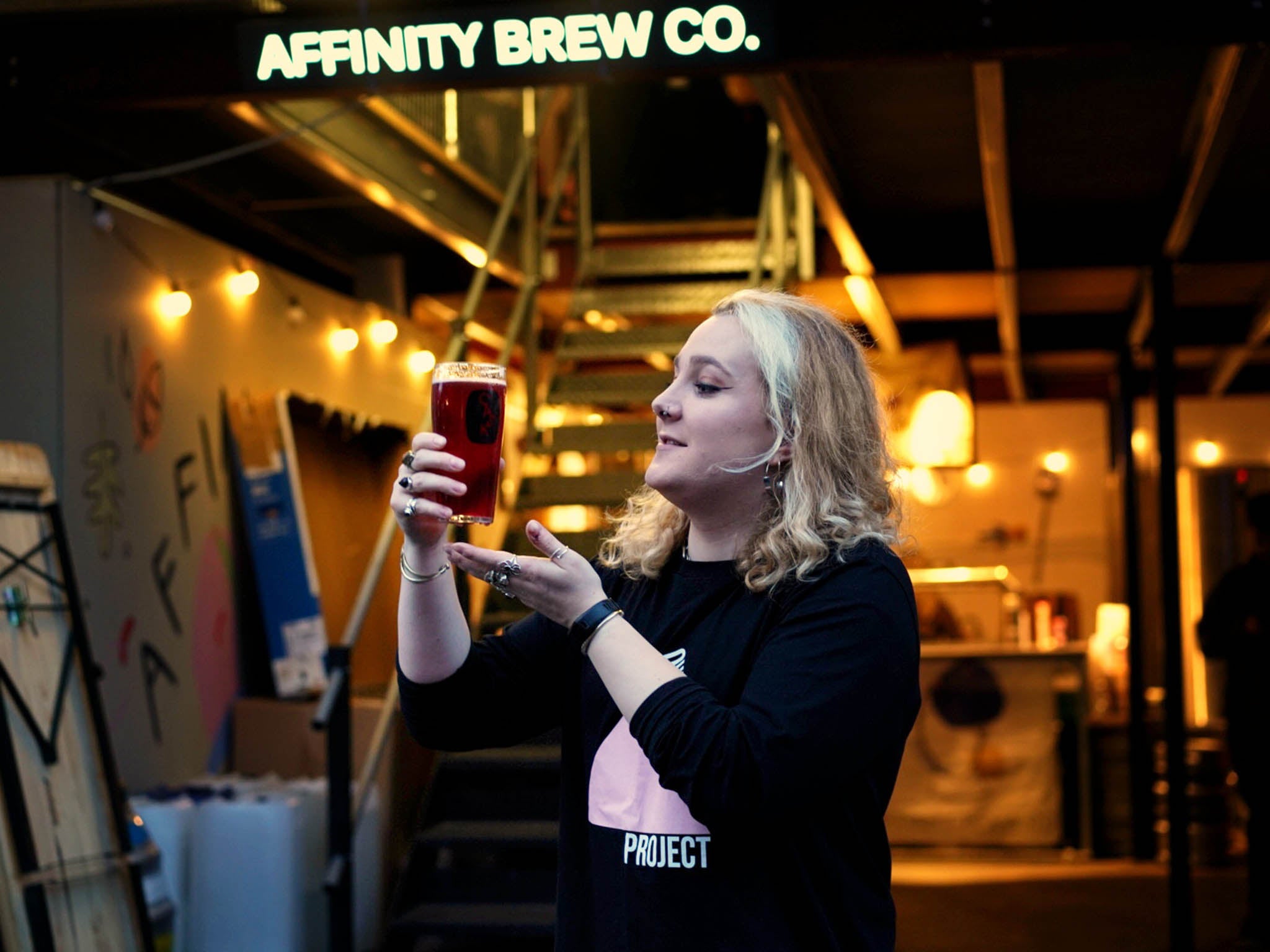 Lily Waite at Affinity Brew Co with The Queer Brewing Project’s Queer Royale