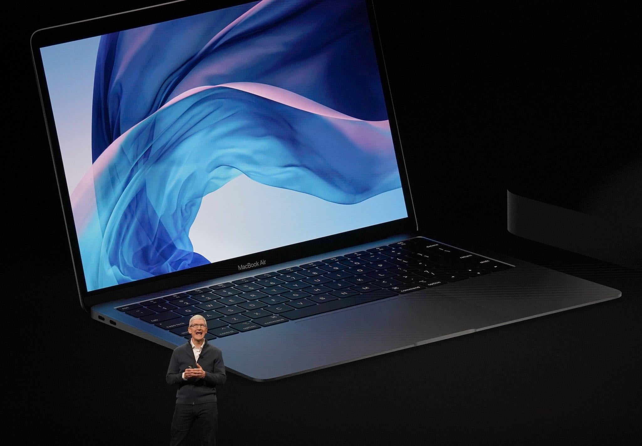 Apple CEO Tim Cook presents new products, including new Macbook laptops, during a special event at the Brooklyn Academy of Music