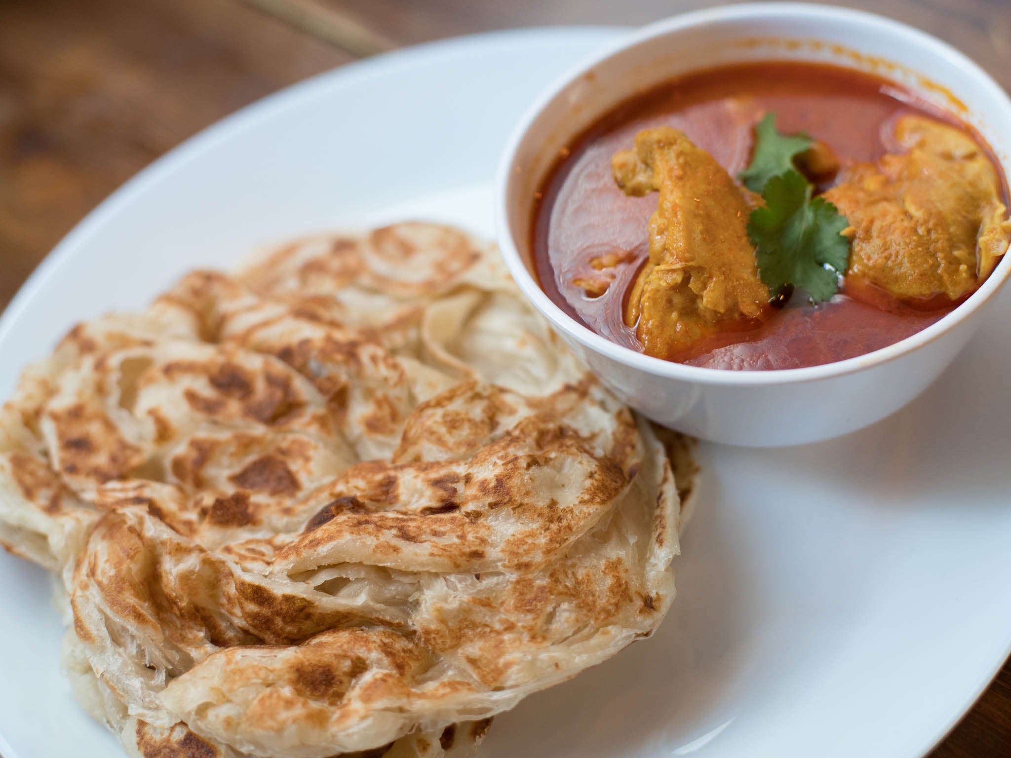 Roti canai is one of the country's most-loved dishes that's also become very popular here too (Gopal's Corner )