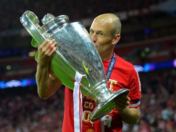 Arjen Robben celebrates with the Champions League trophy in 2013