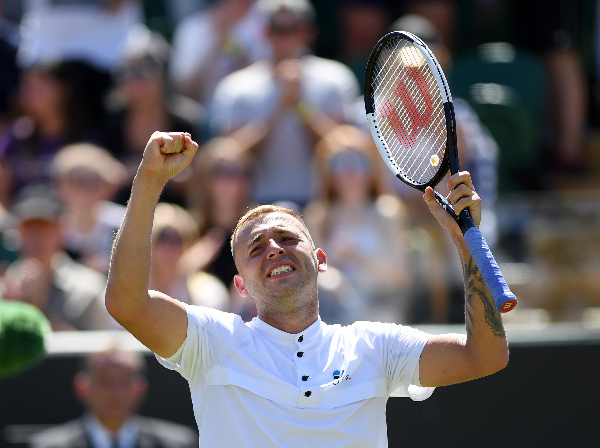 Dan Evans celebrates his win