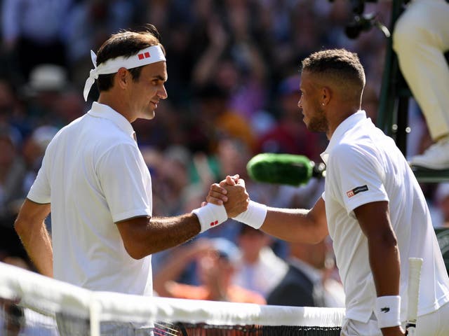 Roger Federer of Switzerland shakes hands with Jay Clarke of Great Britain