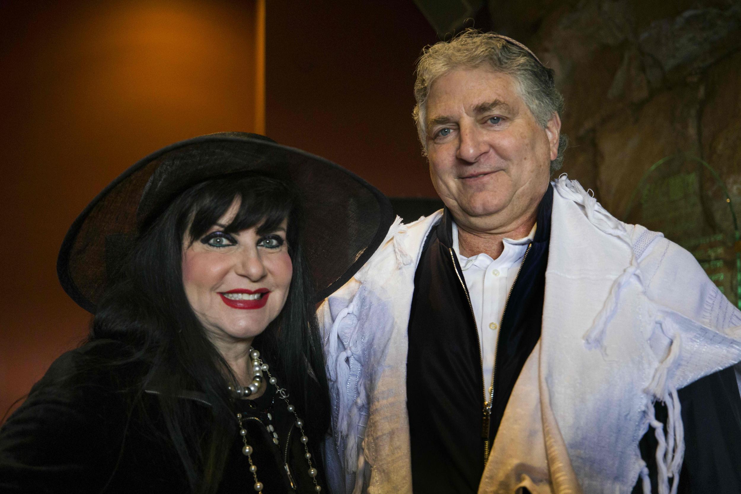 In this April 22, 2019 photo, Simon and Jana Falic pose for a photo as they participate in a blessing during the Jewish holiday of Passover, at the Western Wall, the holiest site where Jews can pray in Jerusalem's old city (AP/Tsafrir Abayov)