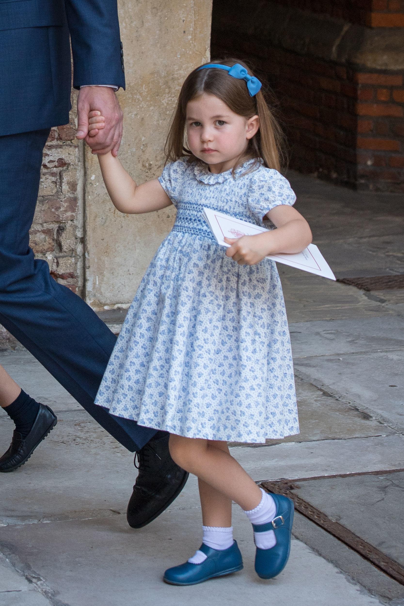 Following Prince Louis’ christening, his sister Princess Charlotte was filmed outside of the chapel scowling at photographers and telling them “you’re not coming”.
Upon hearing his daughter's funny remark, Prince William slightly smirked at the cameras. The cheeky demeanour was moment was reminiscent of the moment the princess stuck out her tongue as she arrived at the Duke and Duchess of Sussex’s wedding in May 2018.