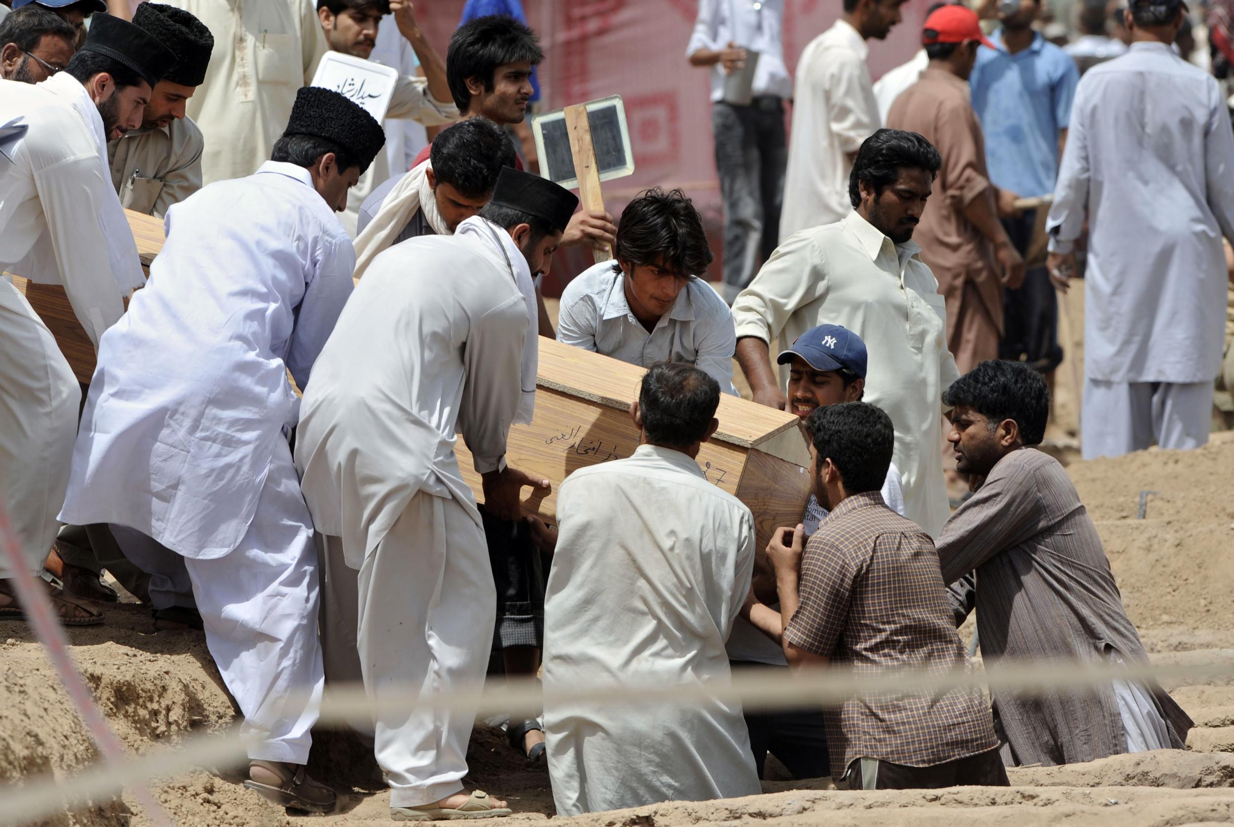 Ahmadis bury a victim of a religious attack on a mosque in 2010 (AFP/Getty)