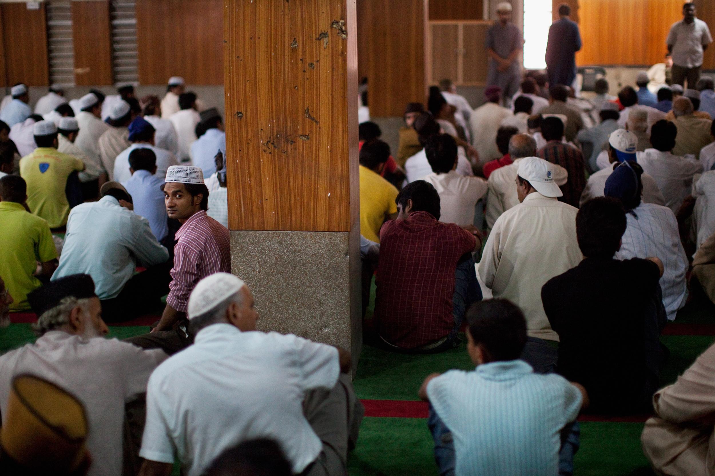 Ahmadis listen to a sermon during Friday prayers at the Garhi Shahu mosque in Lahore (Getty)