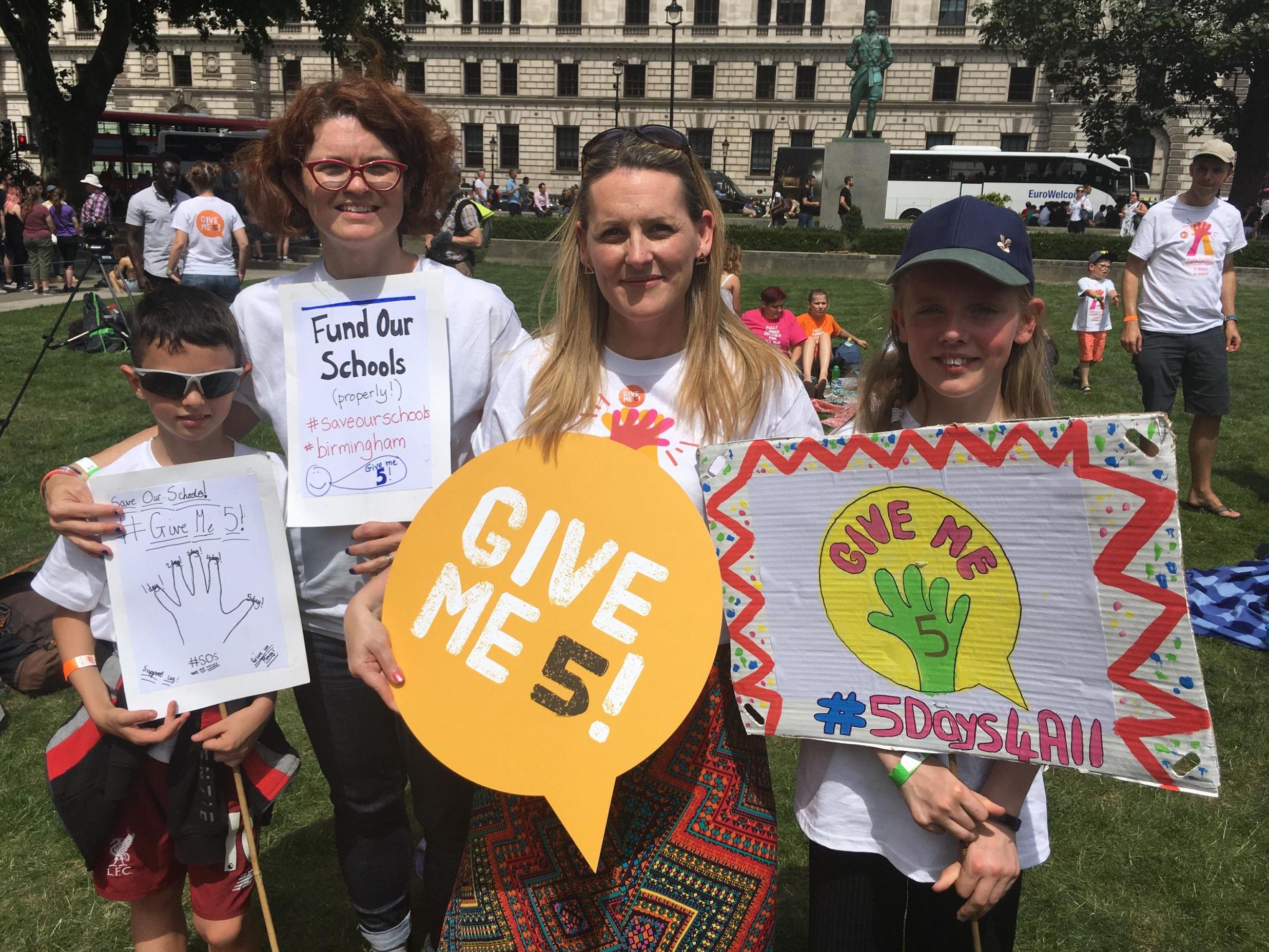 Parents Mary Ellen Flynn and Marie Kershaw with their children on the protest