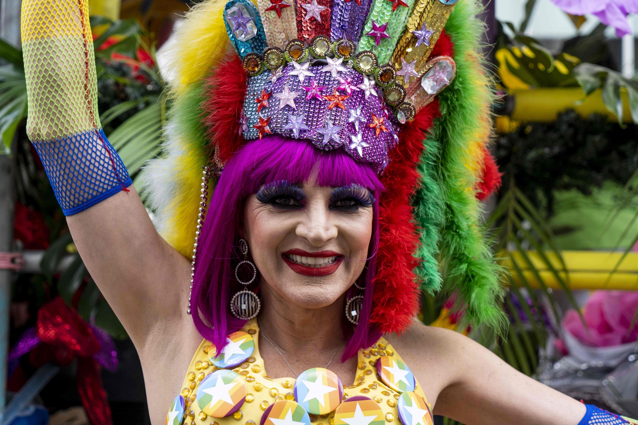 Attendee, resplendent in rainbow gear, at Pride in London 2019