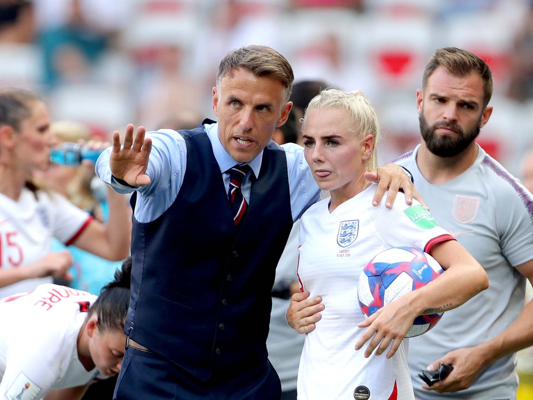 England head coach Phil Neville talks tactics with Alex Greenwood