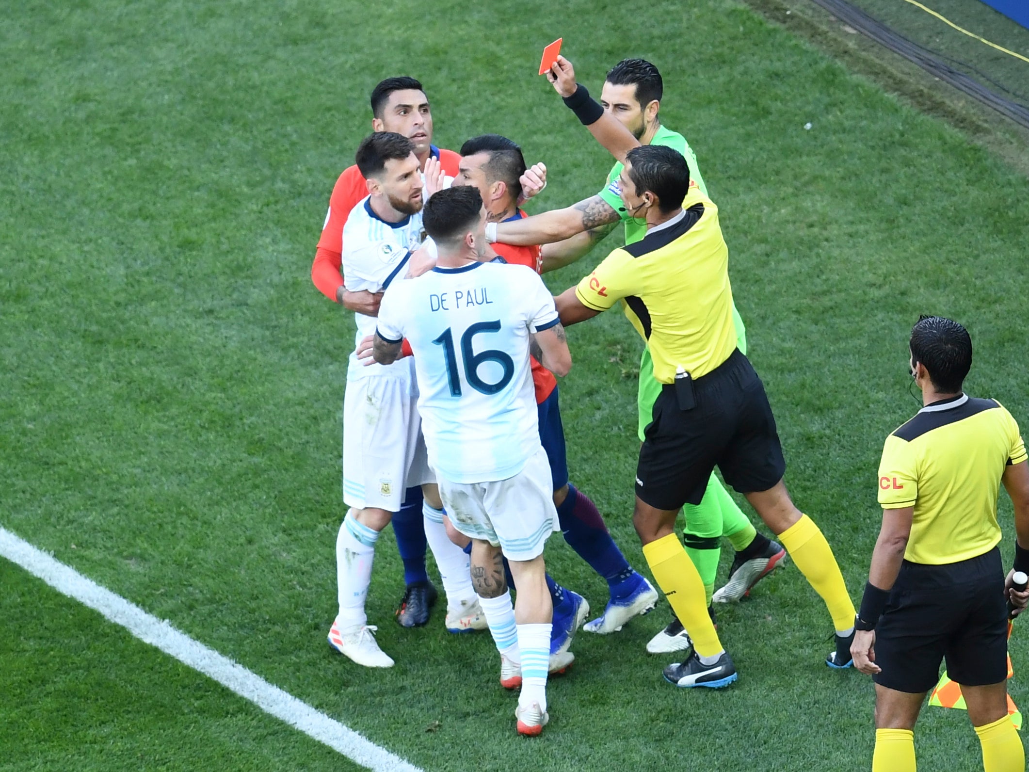 Lionel Messi is shown a red card