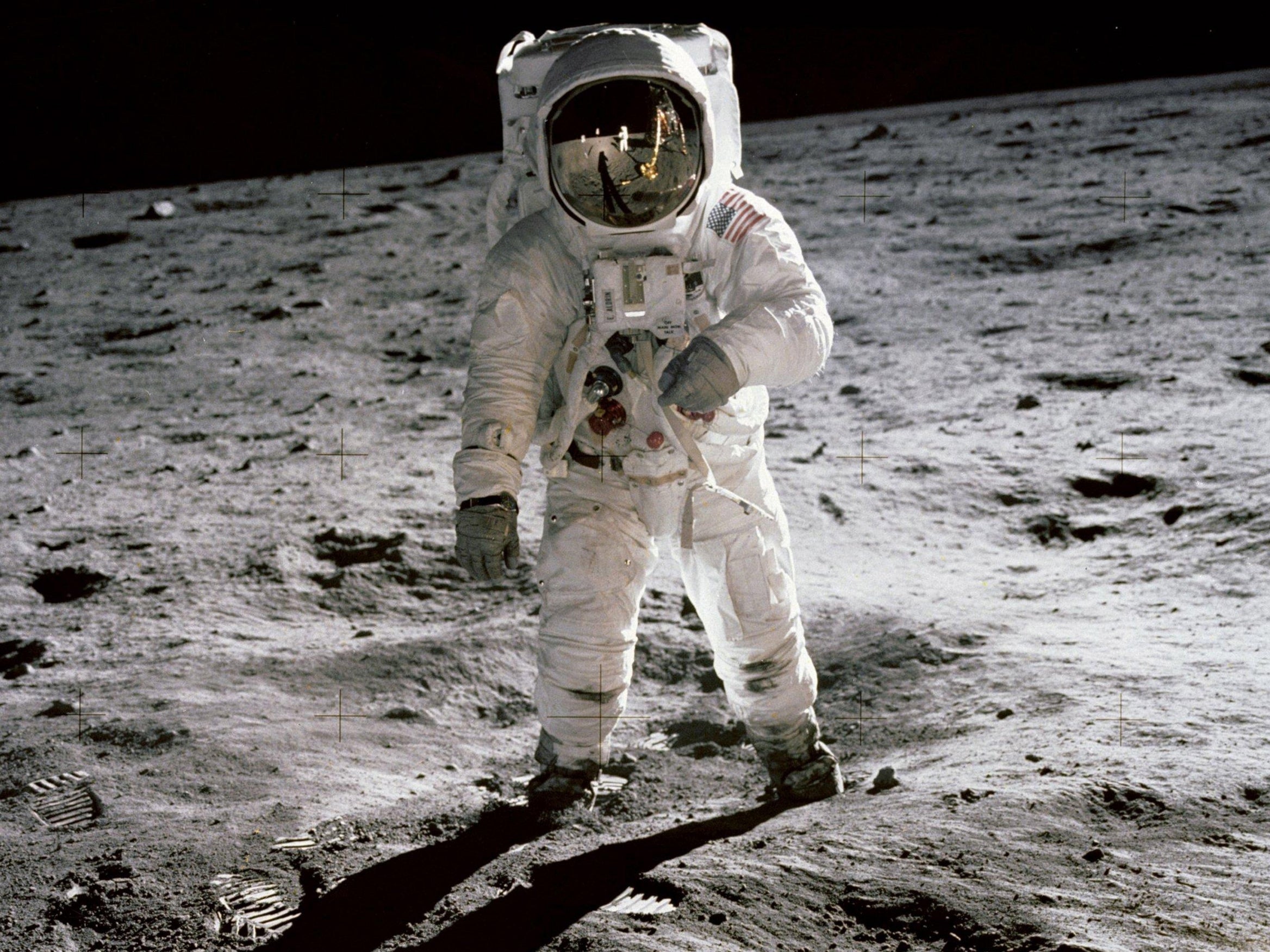 Buzz Aldrin walks on the moon in an image taken by Apollo 11 commander Neil Armstrong.